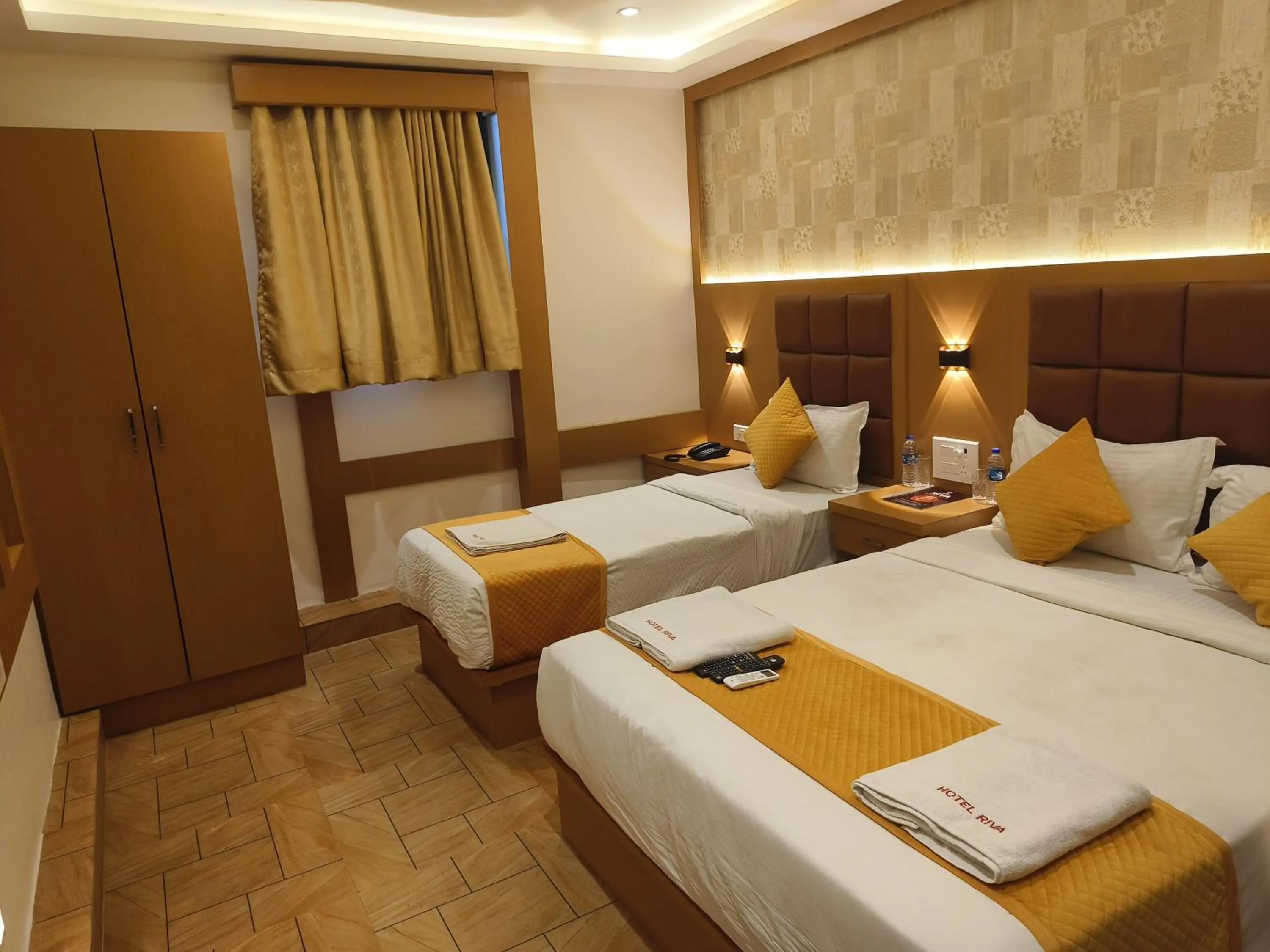 Bed in Hotel Riva International Goregaon- Near NESCO