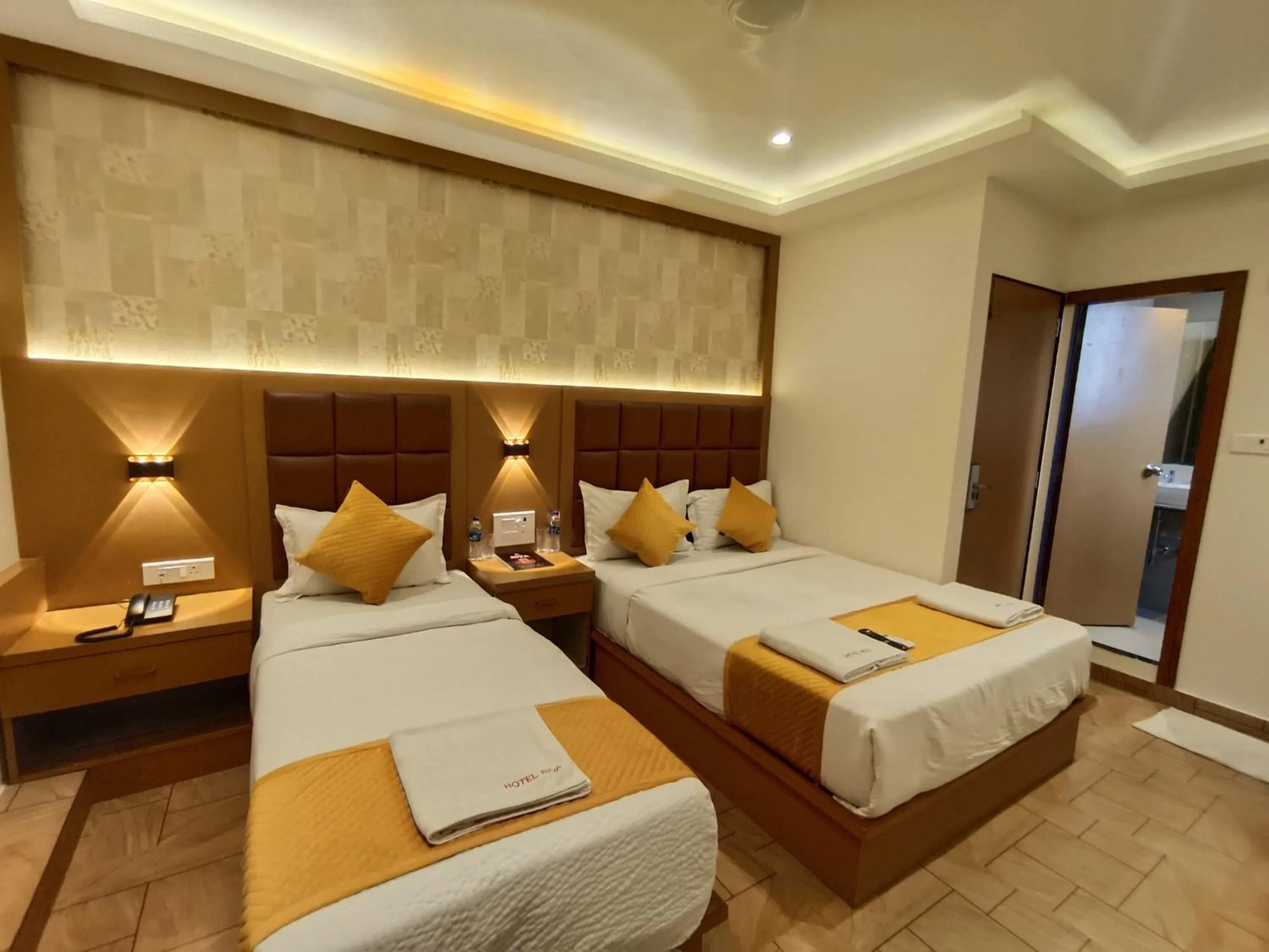 Bed in Hotel Riva International Goregaon- Near NESCO