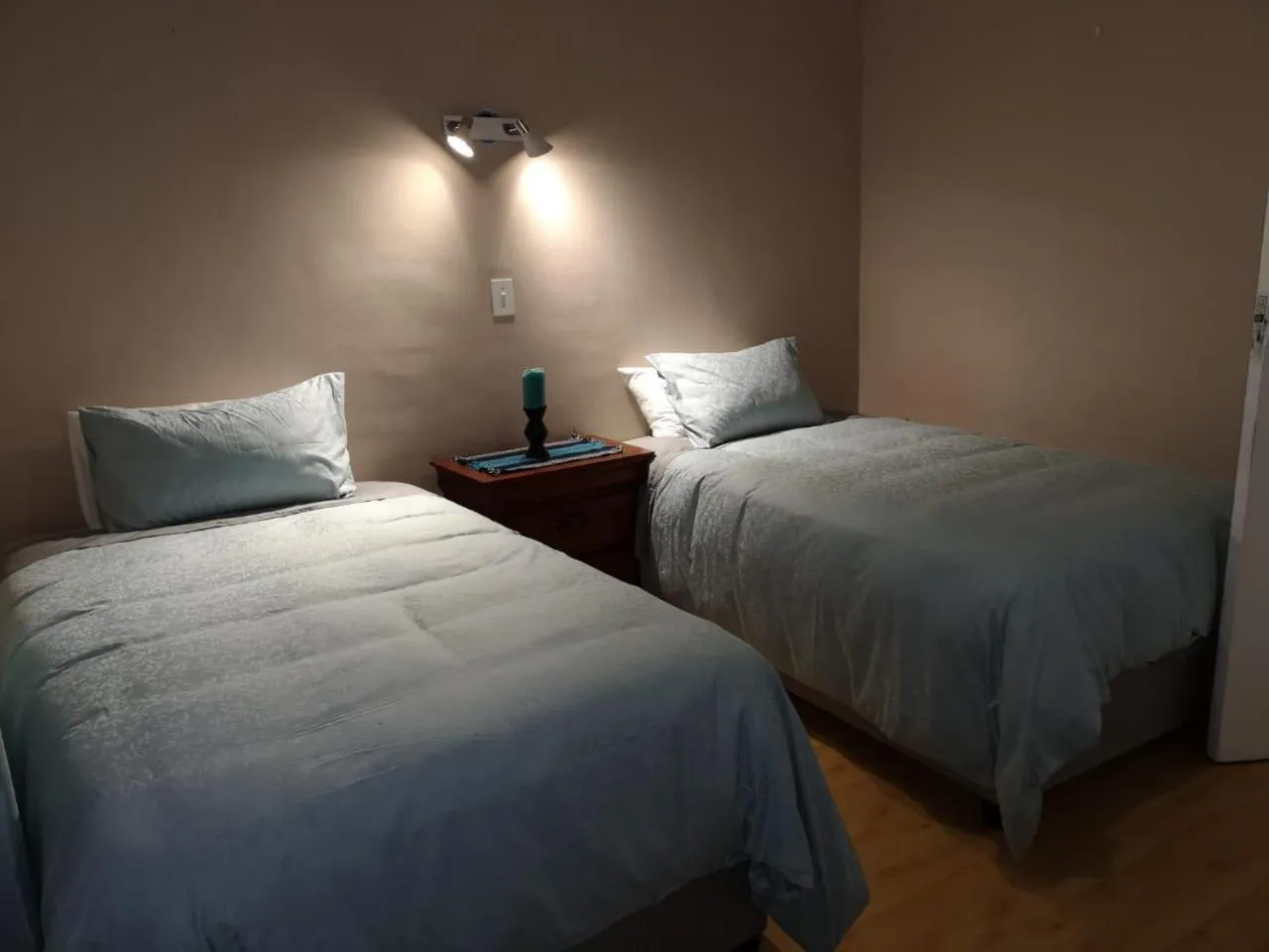 Bed in TwinnPalms Accommodation