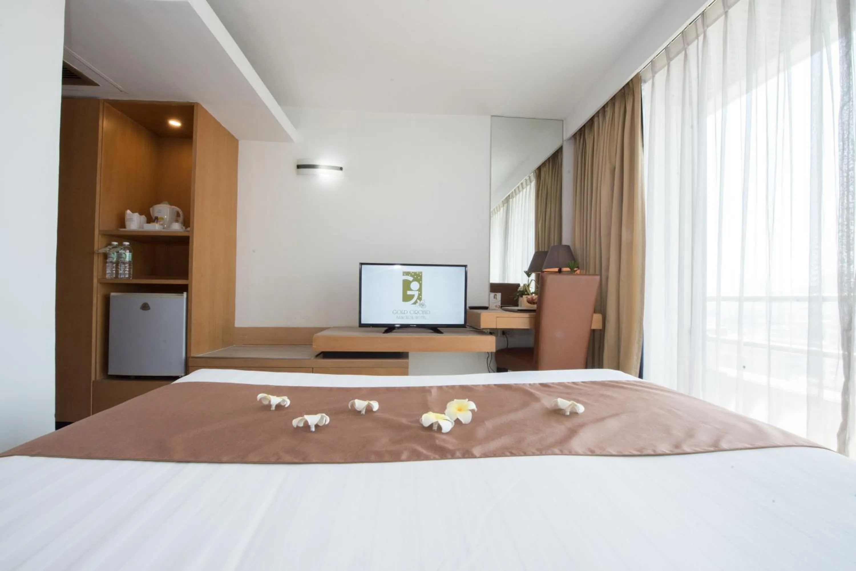 Bed in Gold Orchid Bangkok Hotel