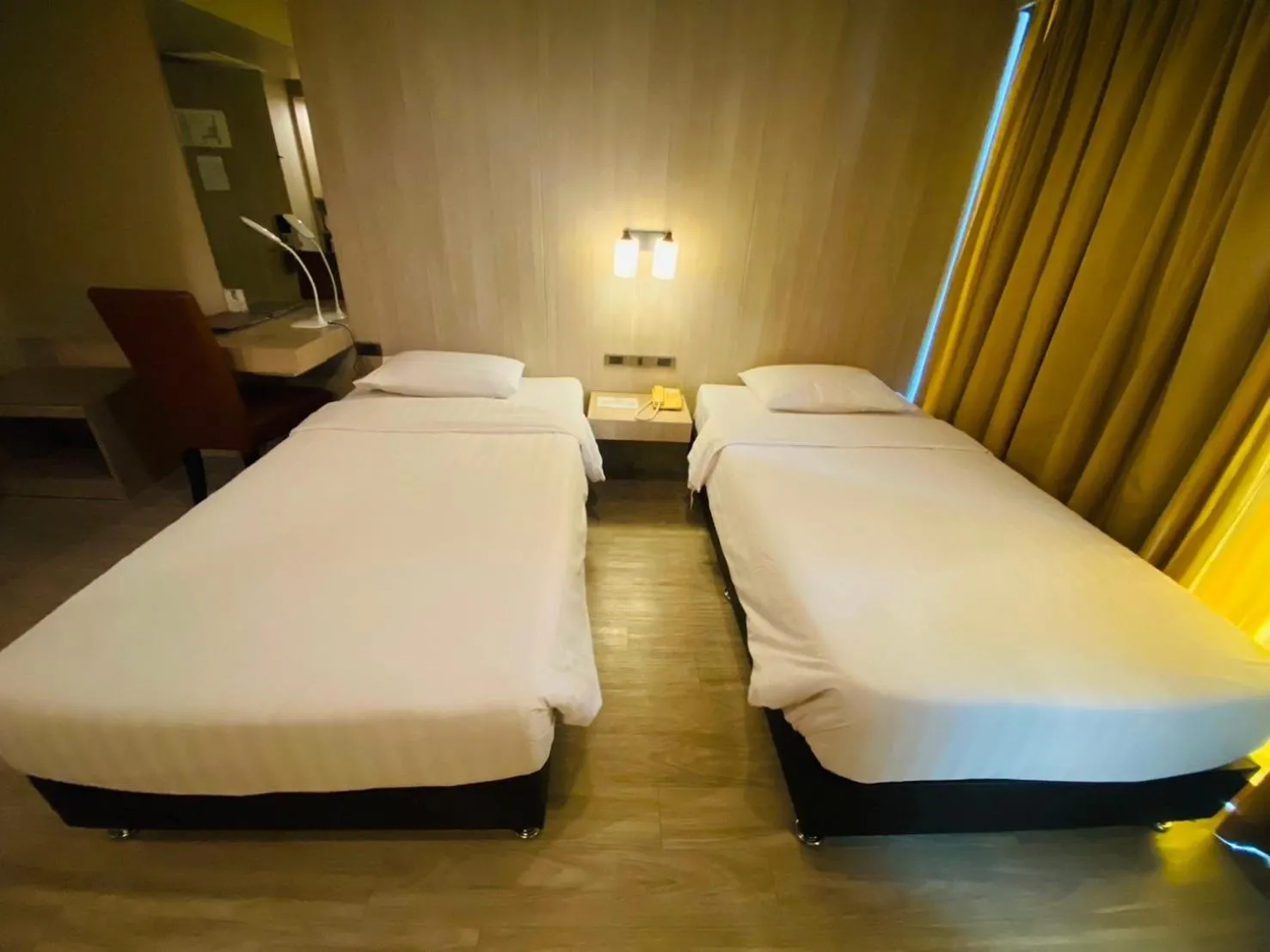 Bed in Gold Orchid Bangkok Hotel