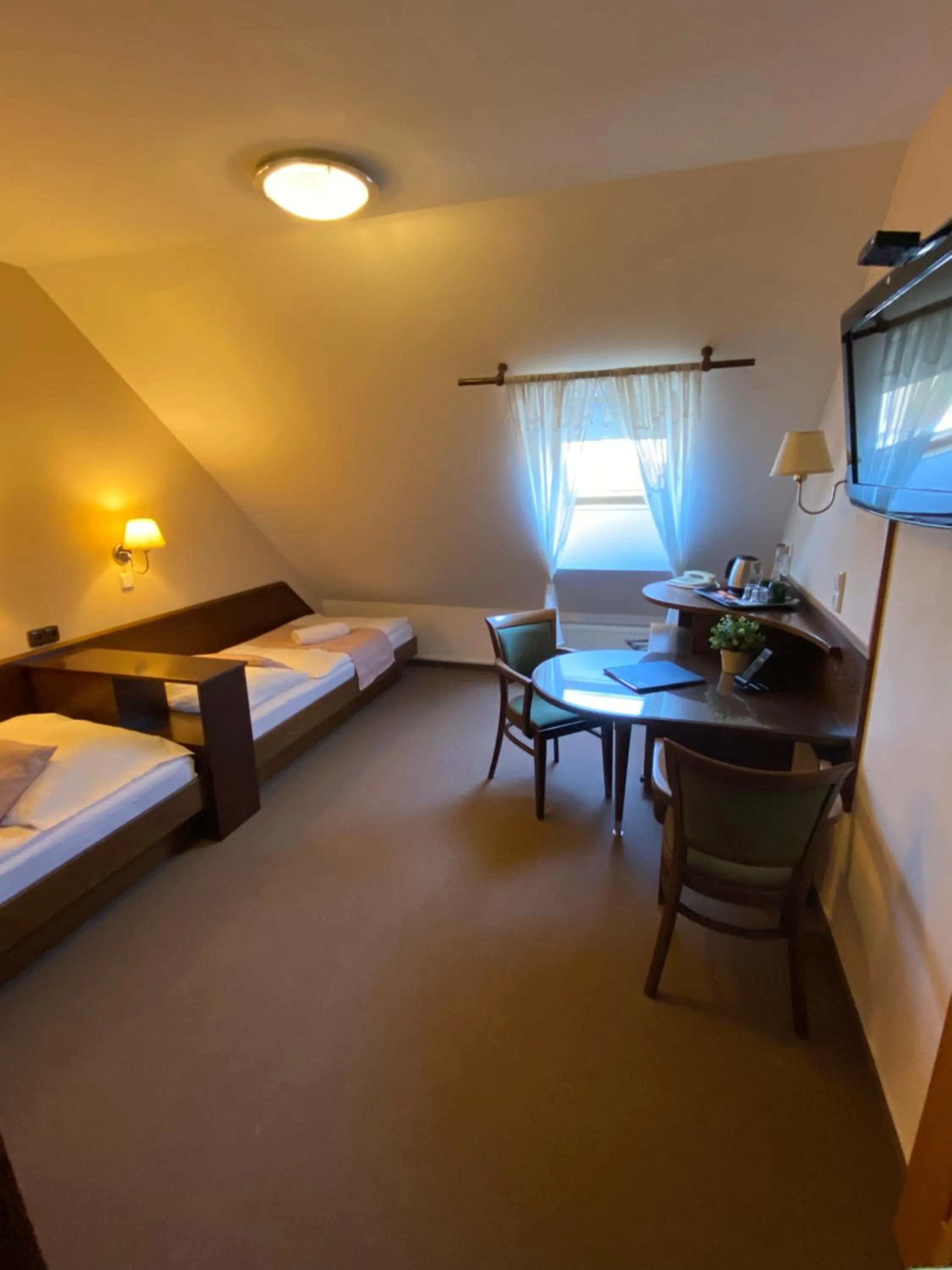 Bed in Zámecký Hotel Zlatý Orel