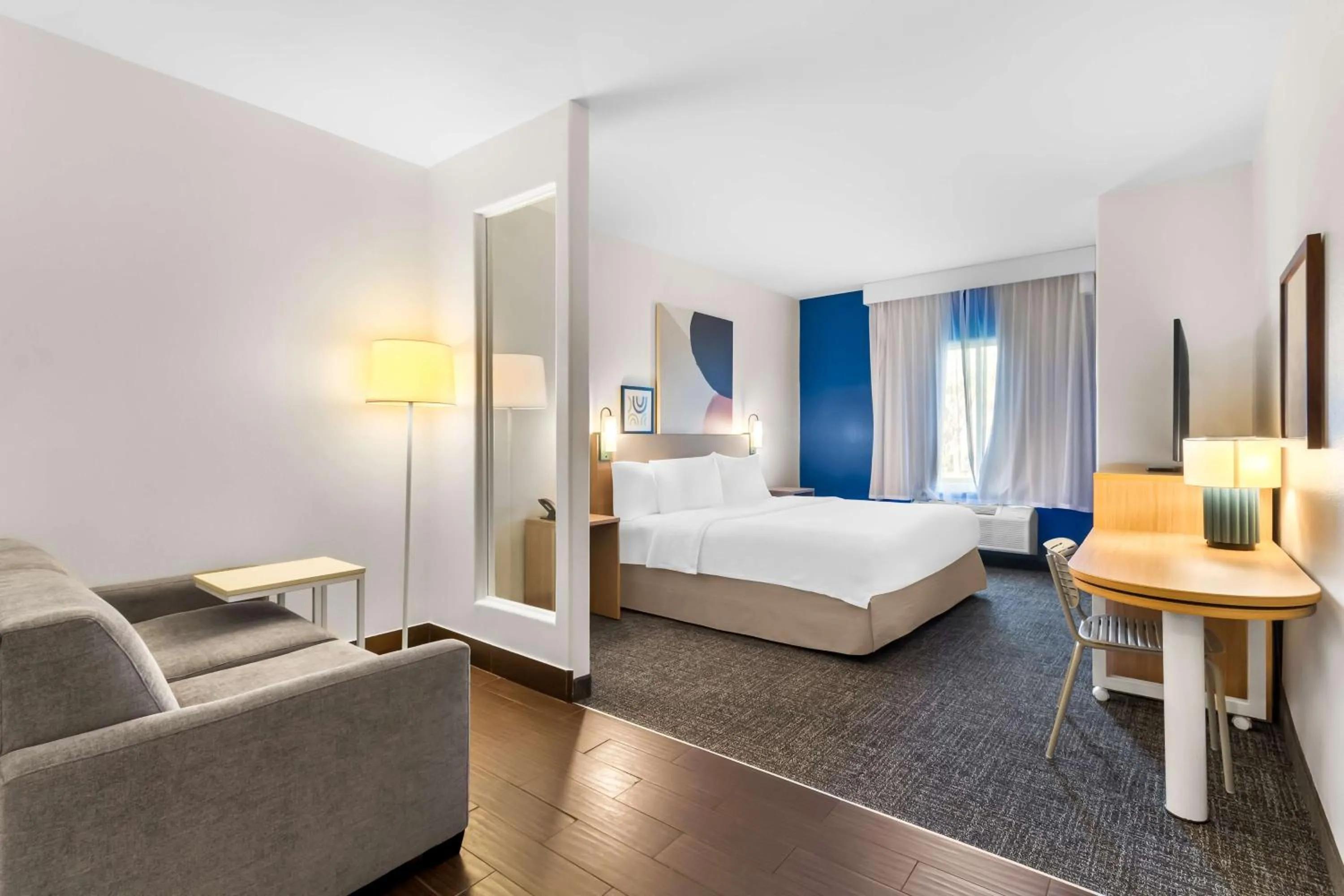 Living room, Bed in Spark by Hilton Pearland