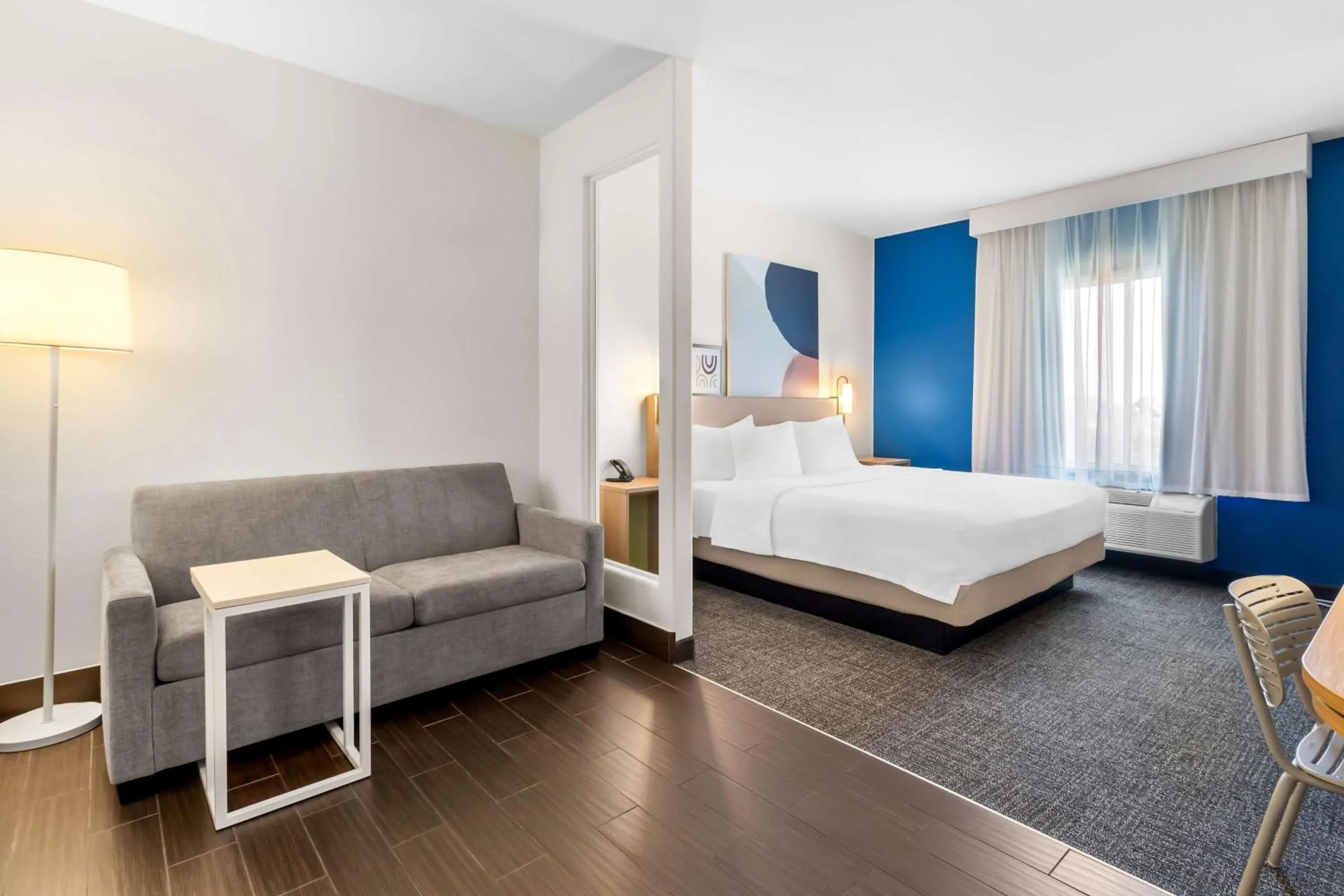 Living room, Bed in Spark by Hilton Pearland