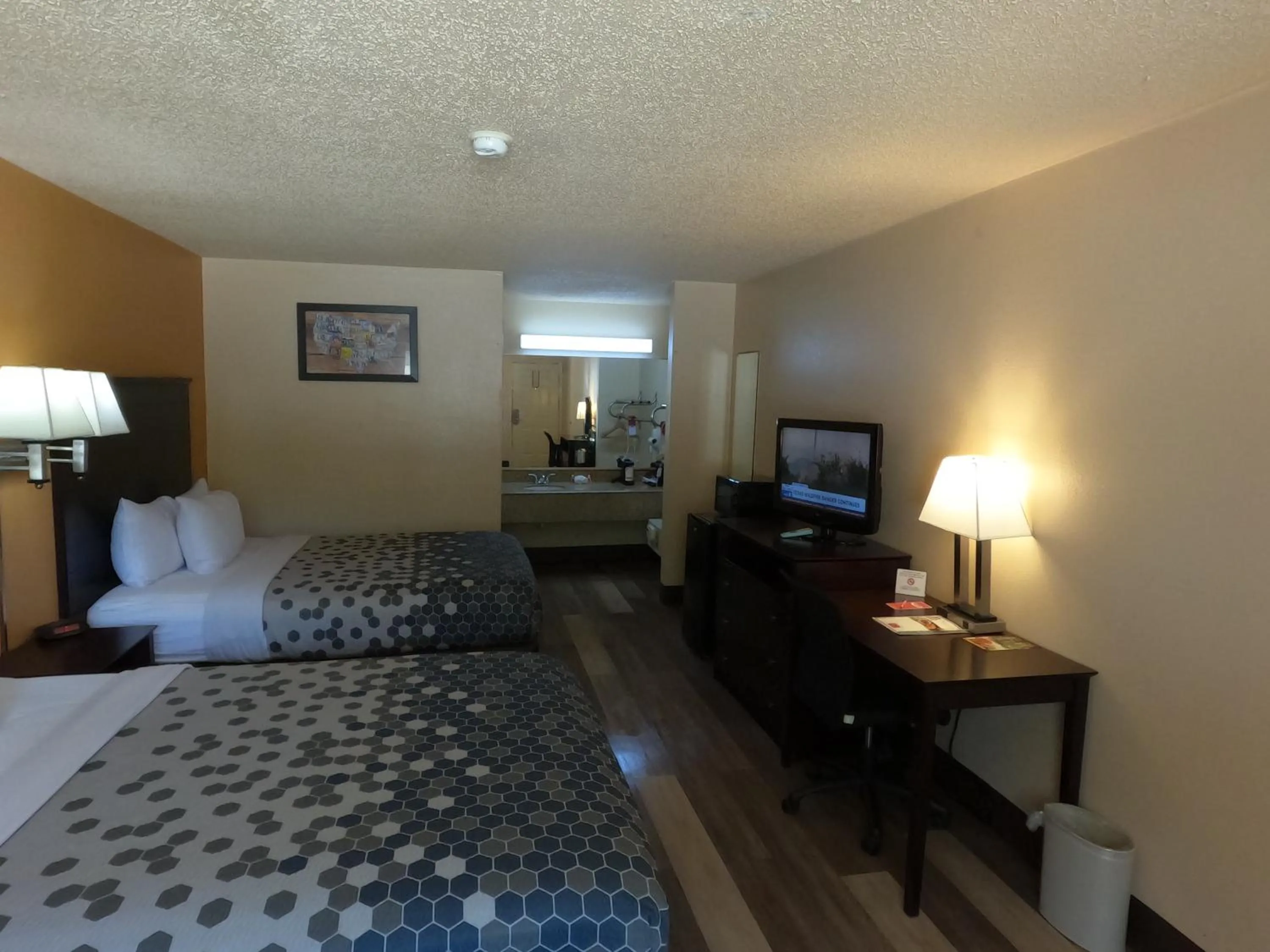 Bed in Econo Lodge Inn & Suites San Antonio near Frost Bank Center