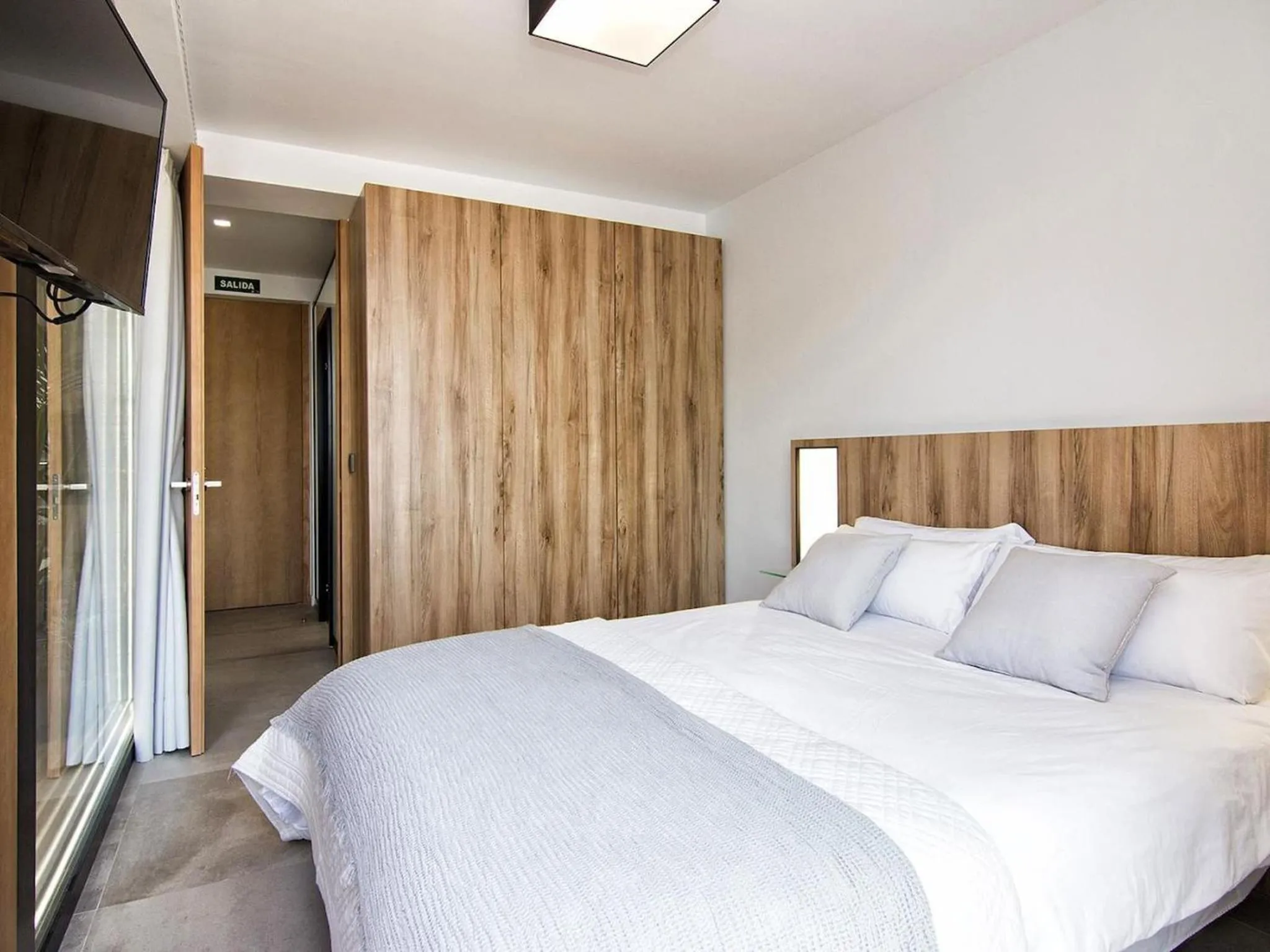 Bed in ChezmoiHomes Luxury Alhambra Penthouse Collection