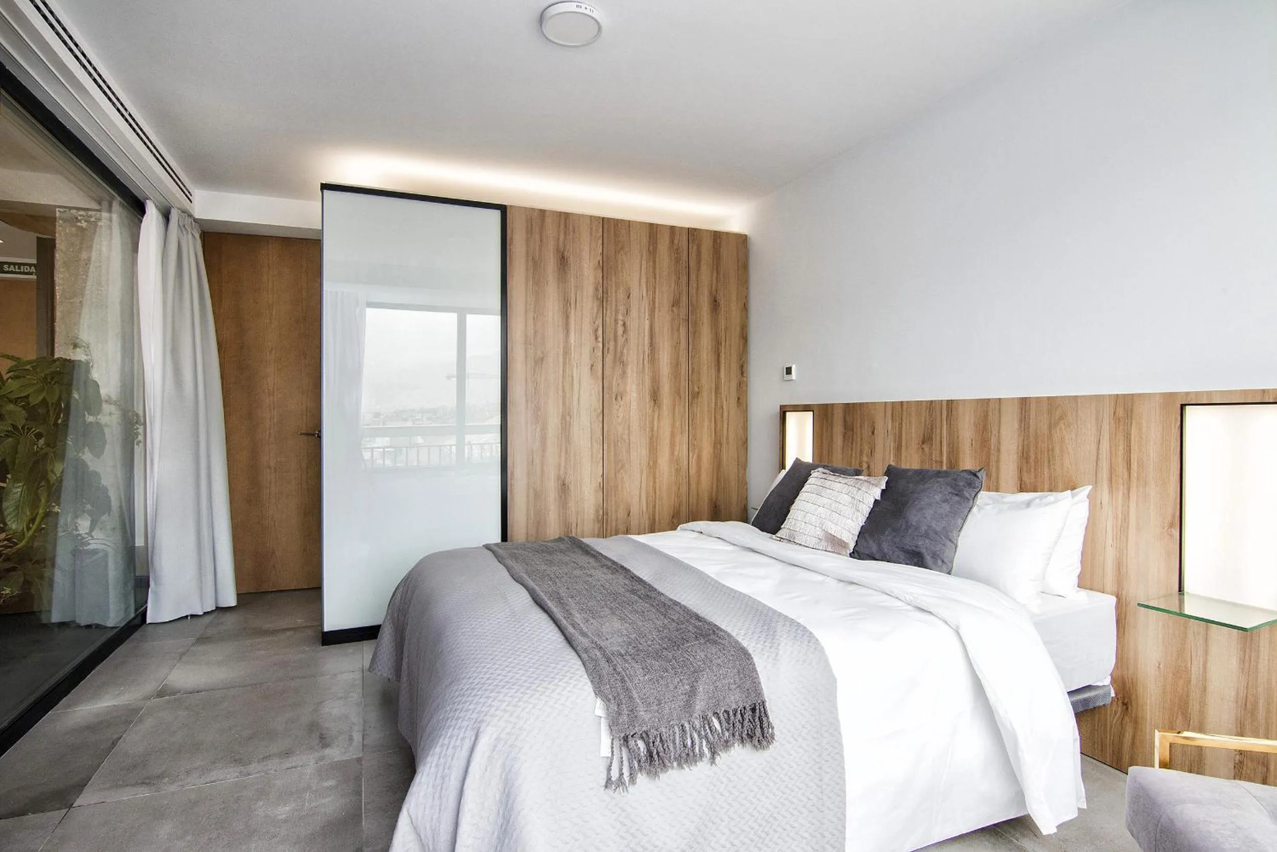 Bed in ChezmoiHomes Luxury Alhambra Penthouse Collection