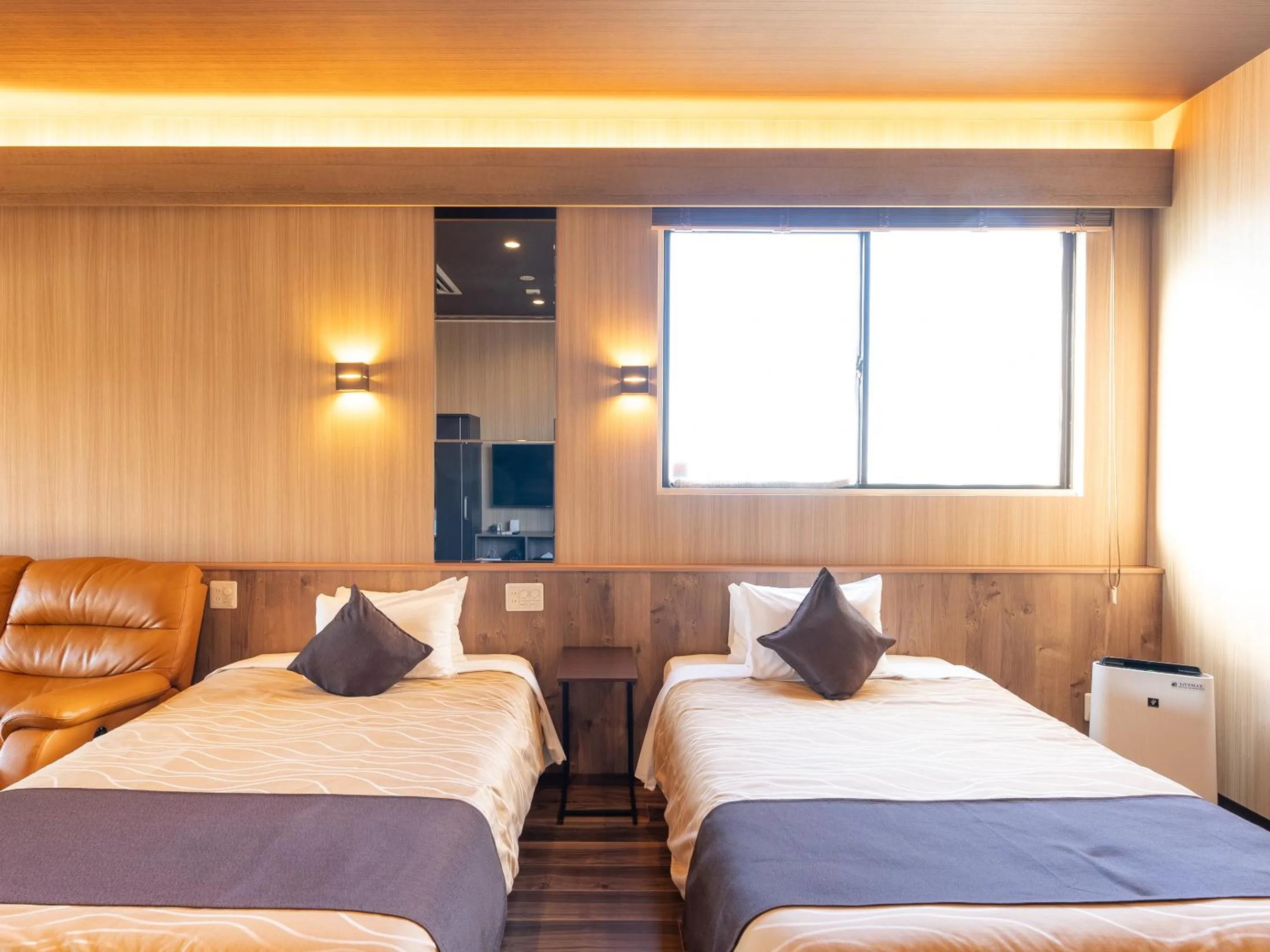 Bed in LiVEMAX RESORT Sakurajima Sea Front