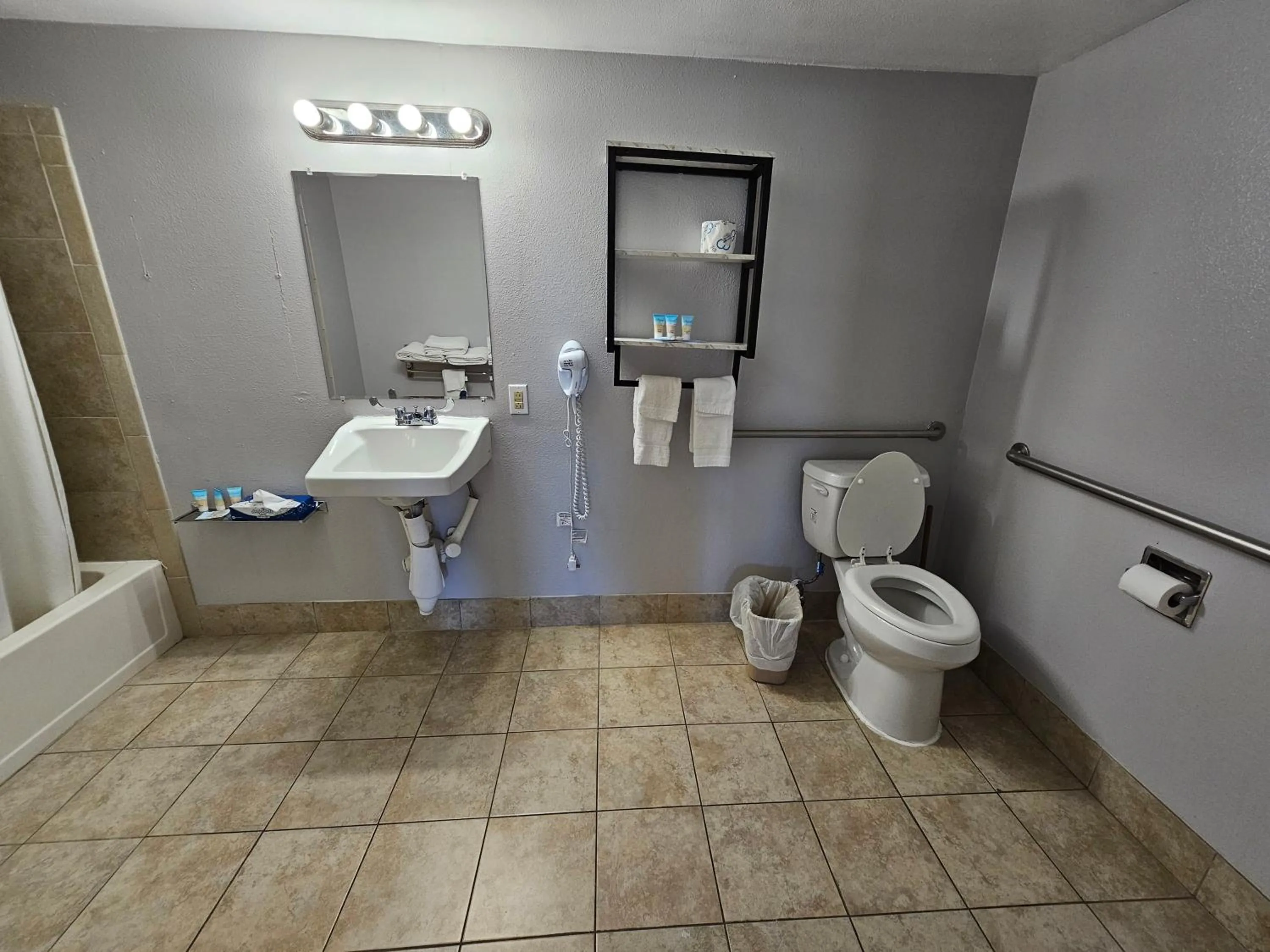 Toilet in Atlantic Shores Inn and Suites