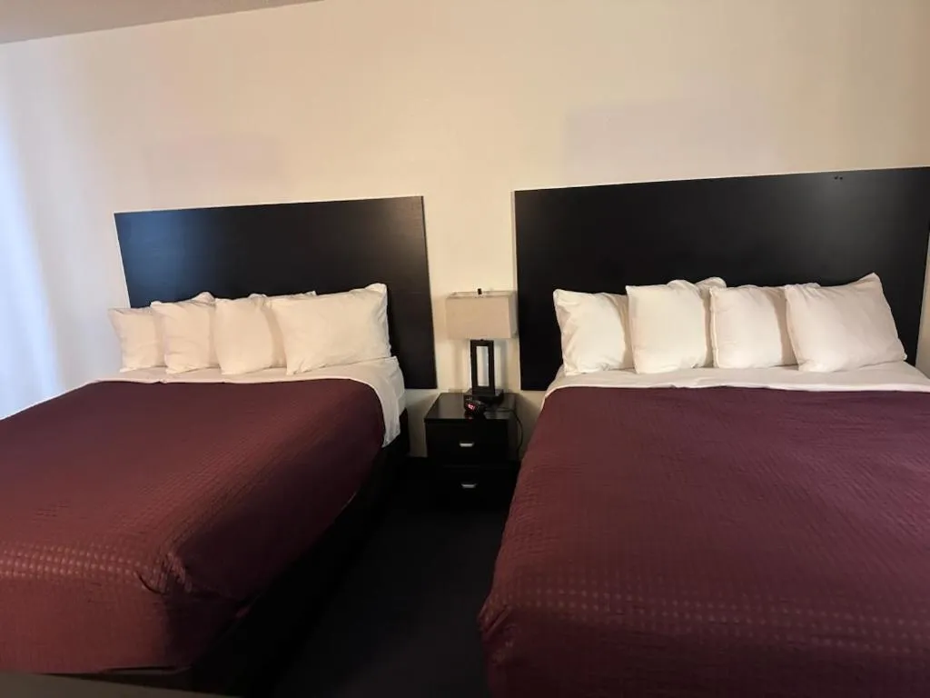 Bed in FairBridge Inn & Suites Sunnyside