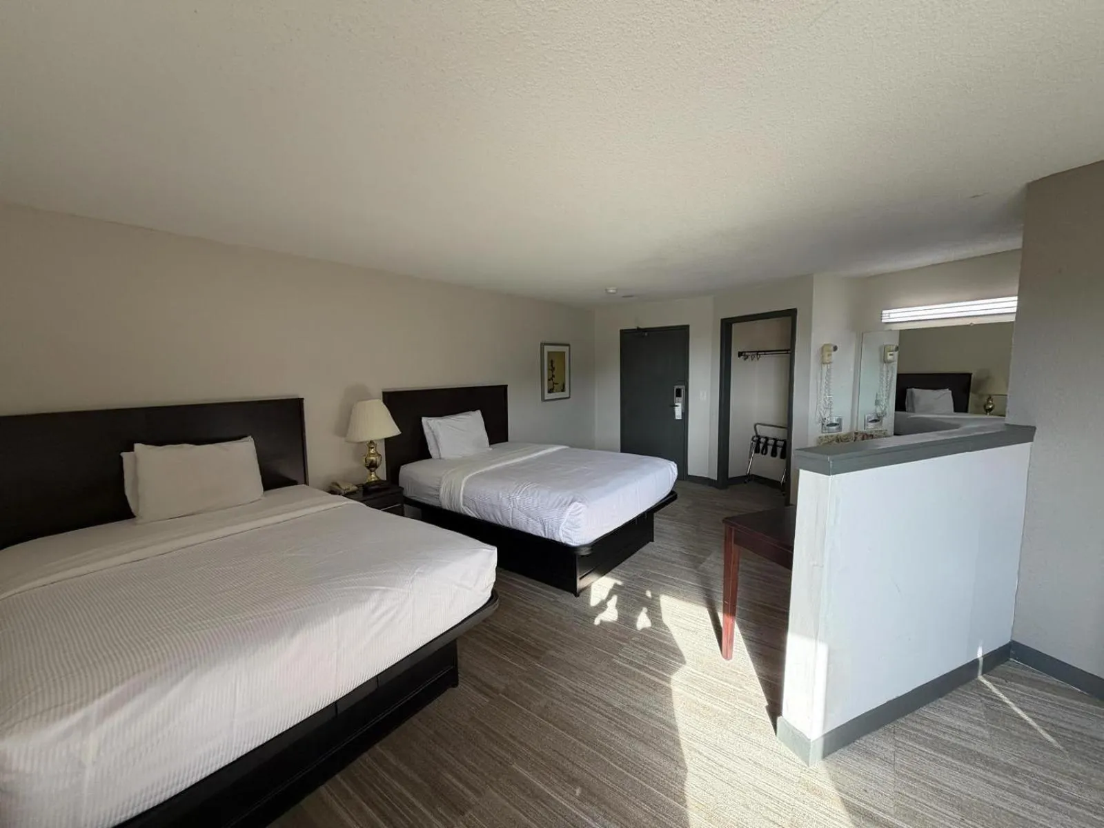 Bed in University Inn & Suites