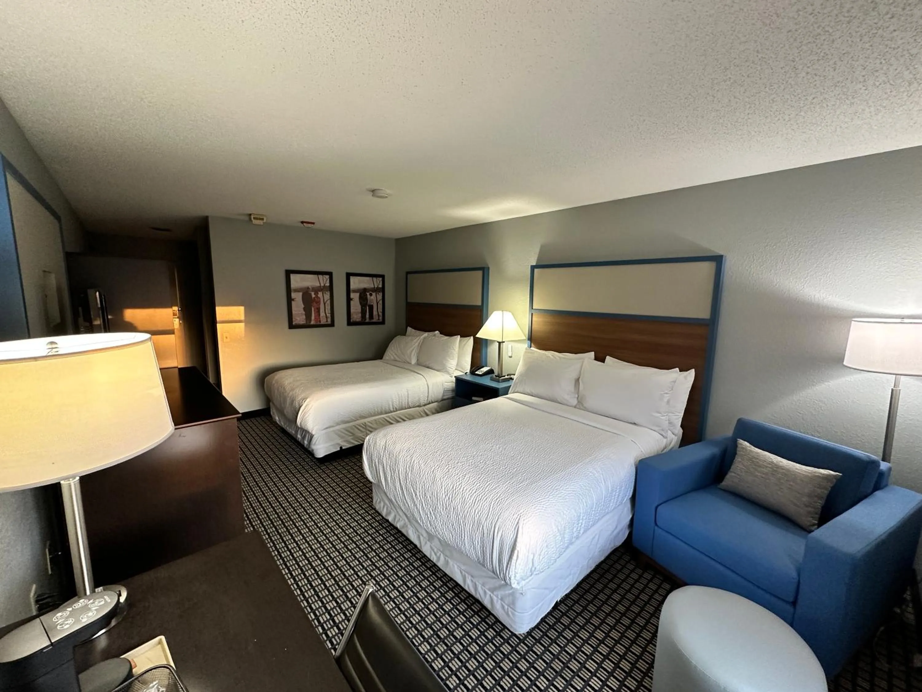 Bed in AmericInn by Wyndham Reedsburg