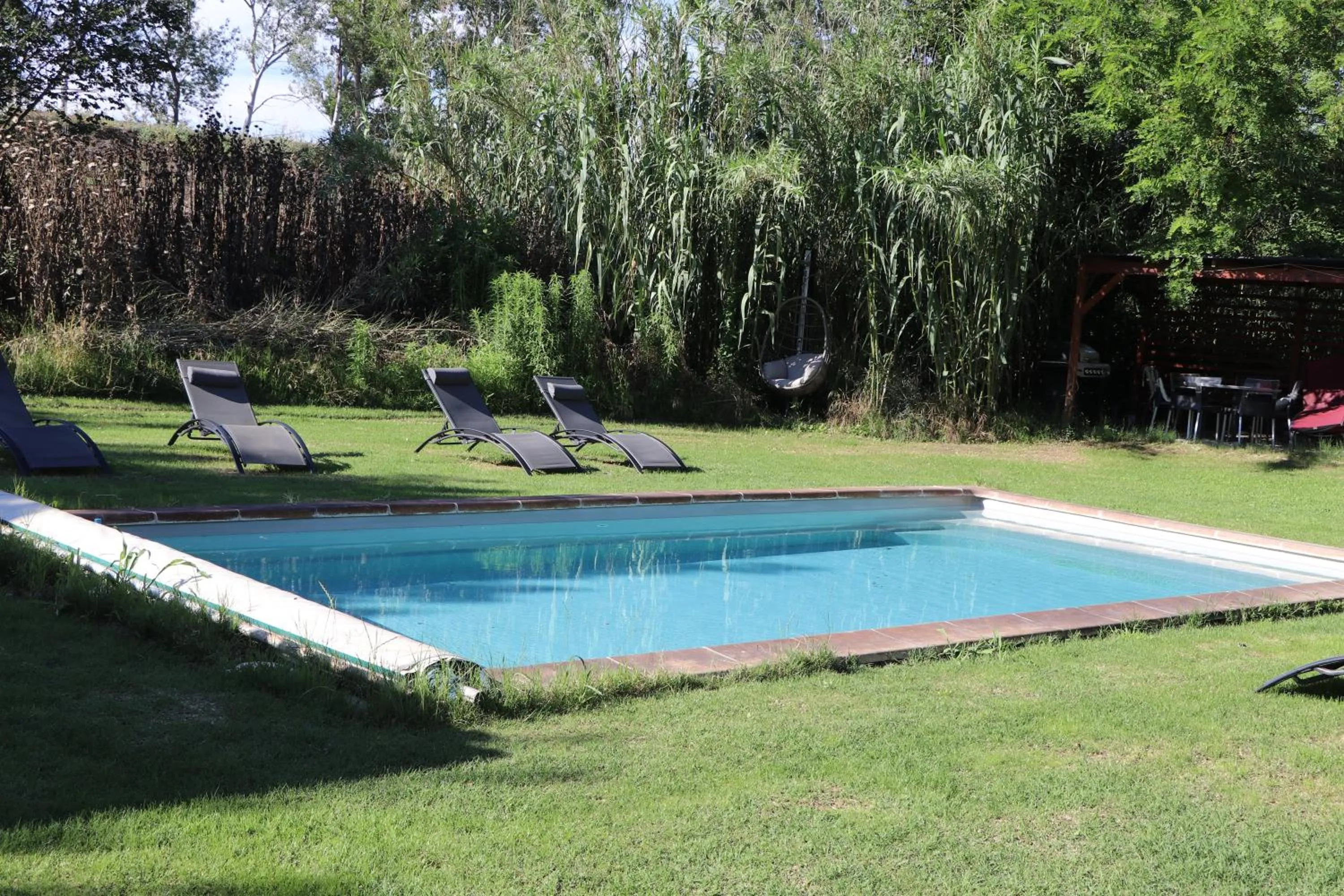 Swimming pool in Le Mas des Cerisiers JACUZZI et SAUNA inclus pour tous les logements