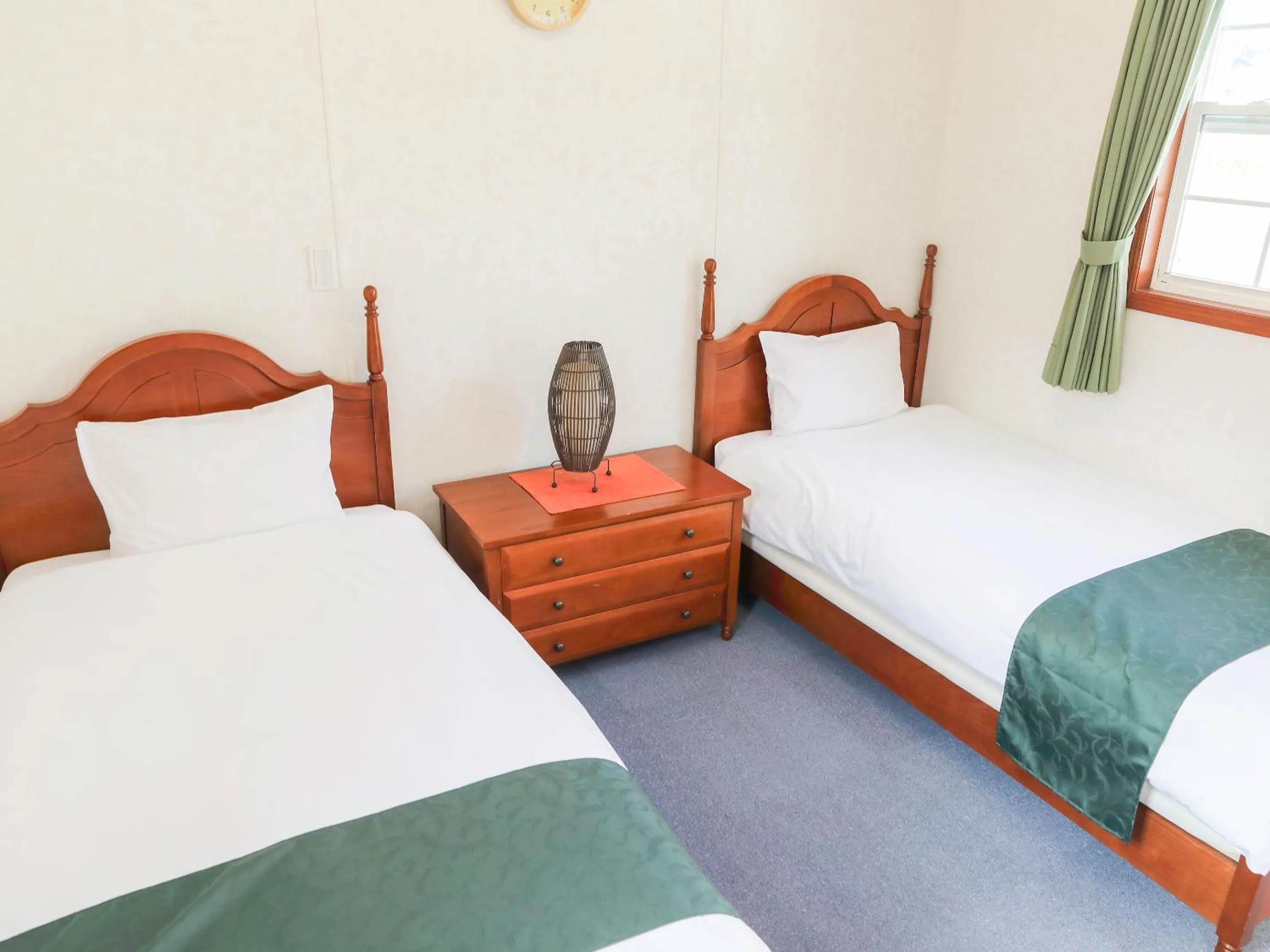 Bed in コテージスターハウス今帰仁