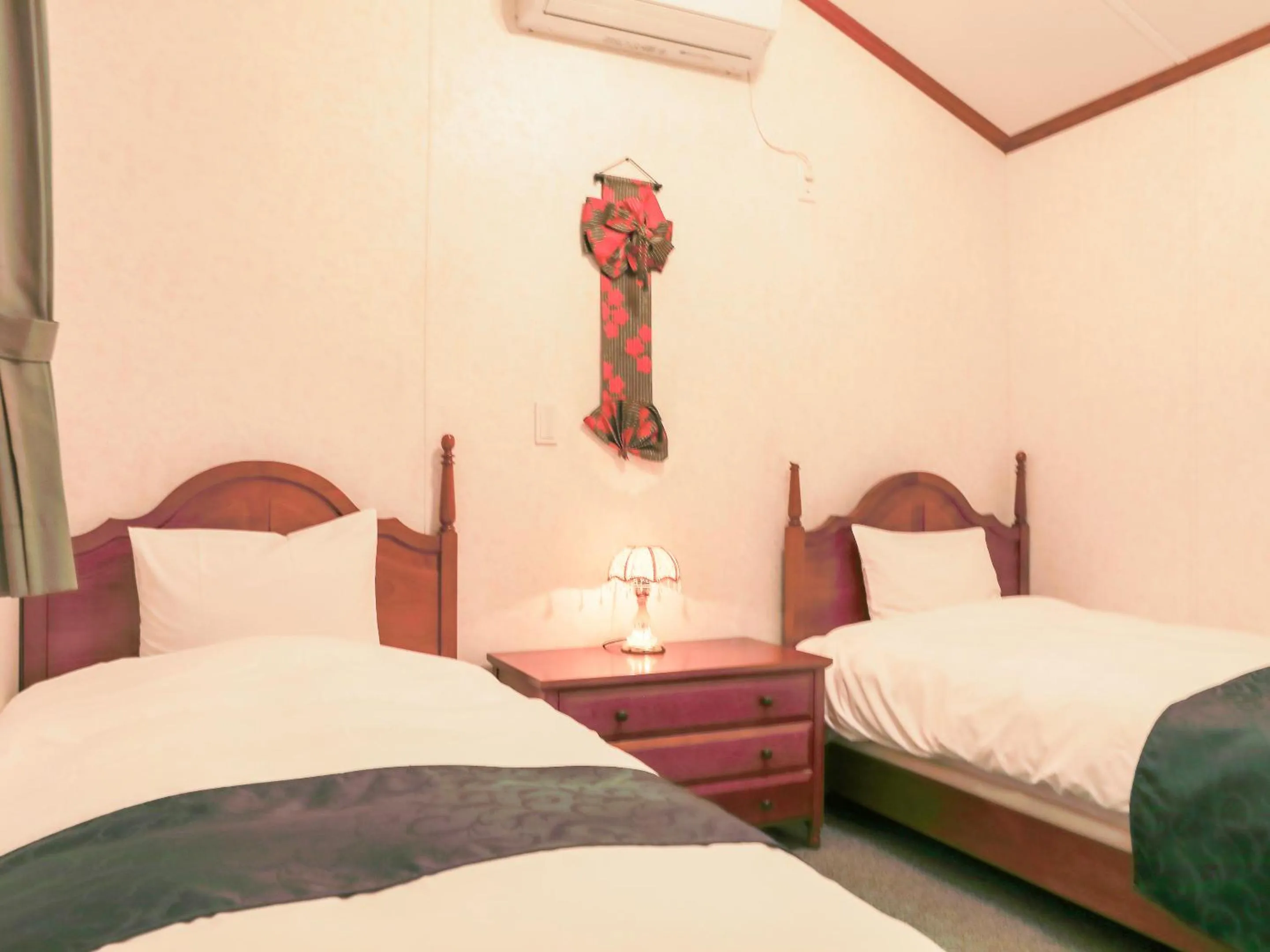 Bed in コテージスターハウス今帰仁