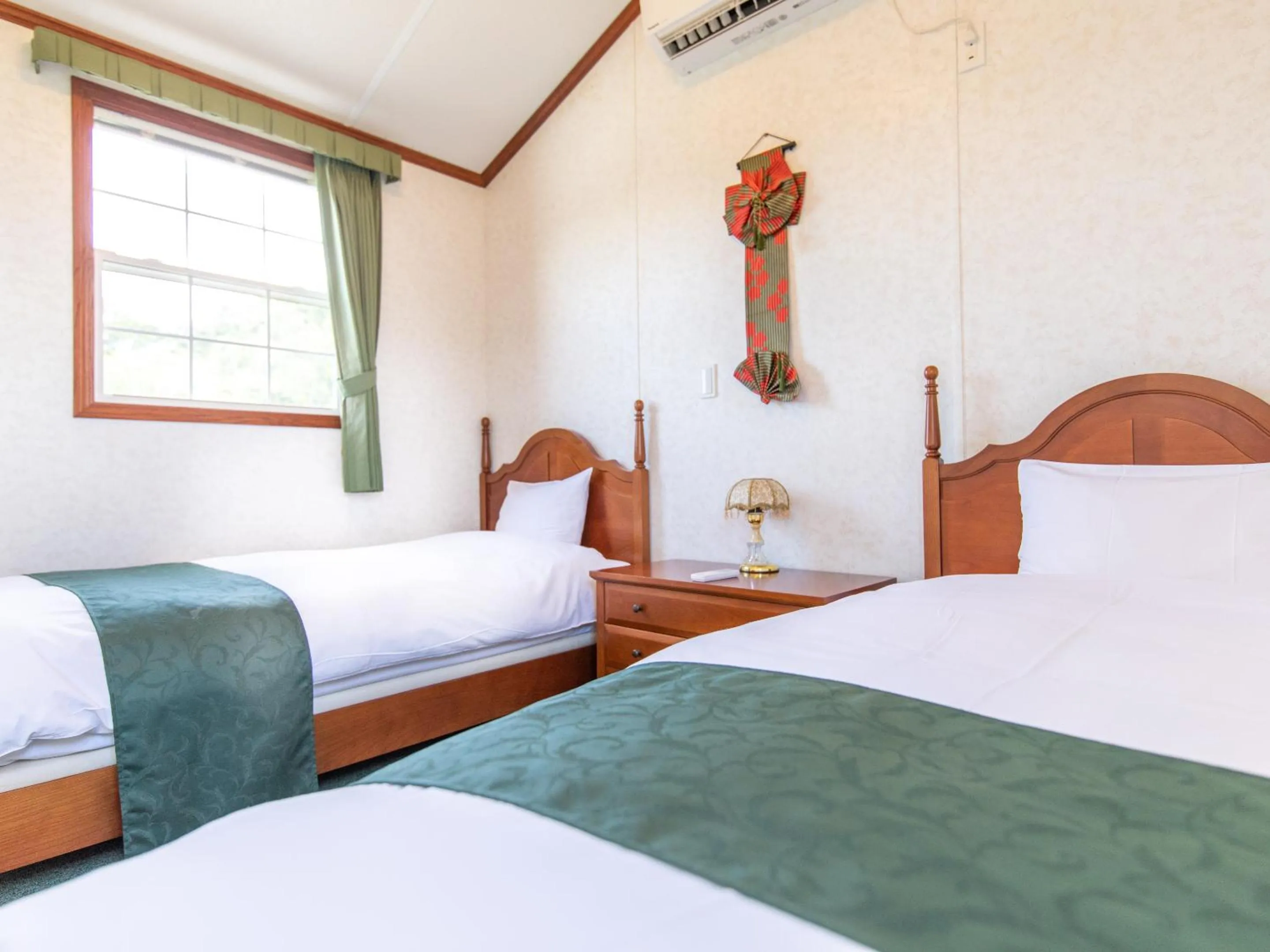 Bed in コテージスターハウス今帰仁