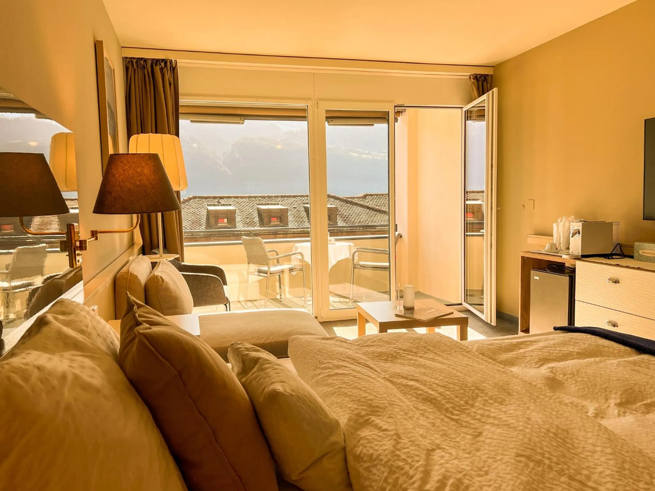 Photo of the whole room, Bed in Seehotel Riviera at Lake Lucerne