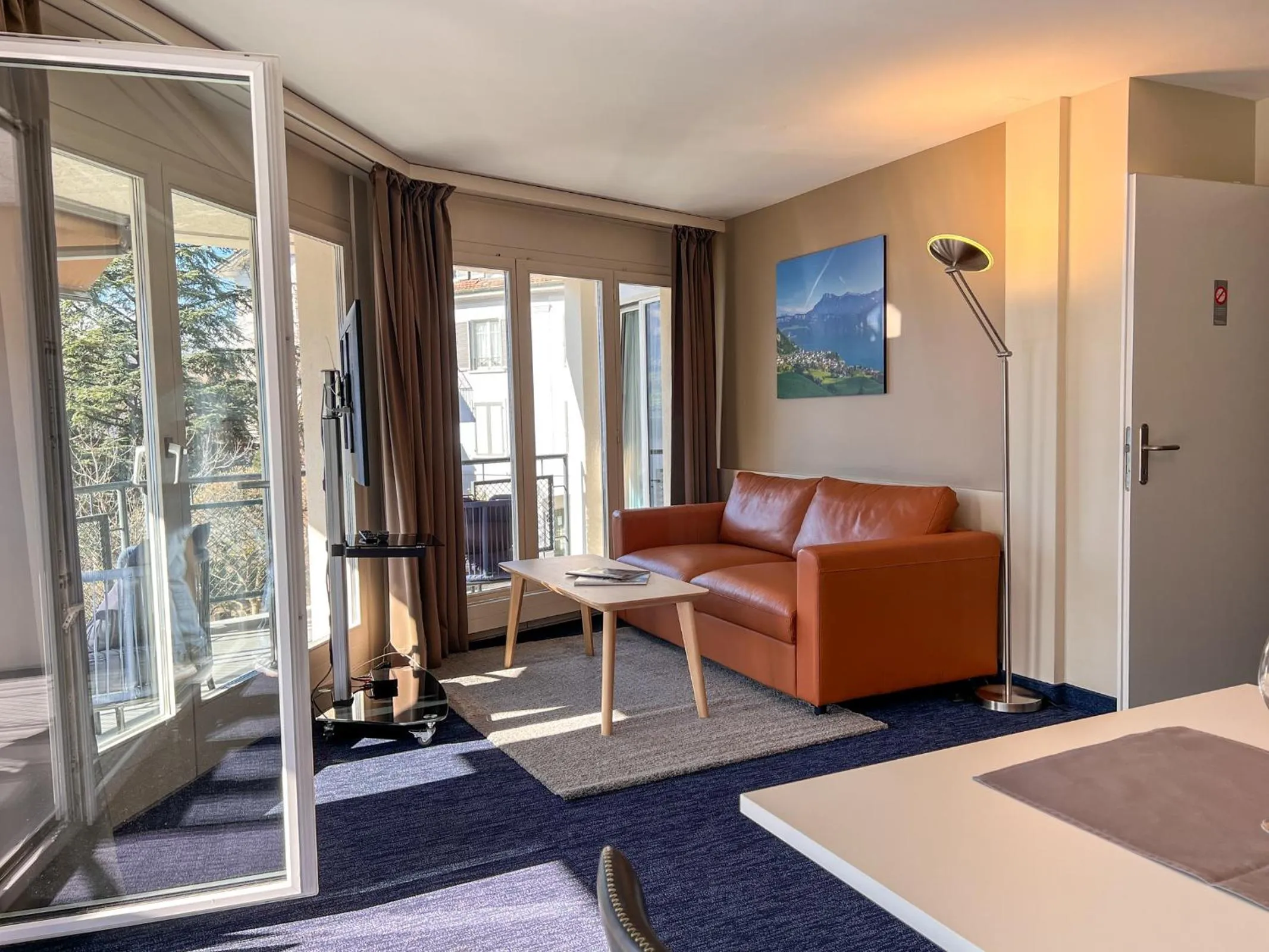 Living room, Bed in Seehotel Riviera at Lake Lucerne