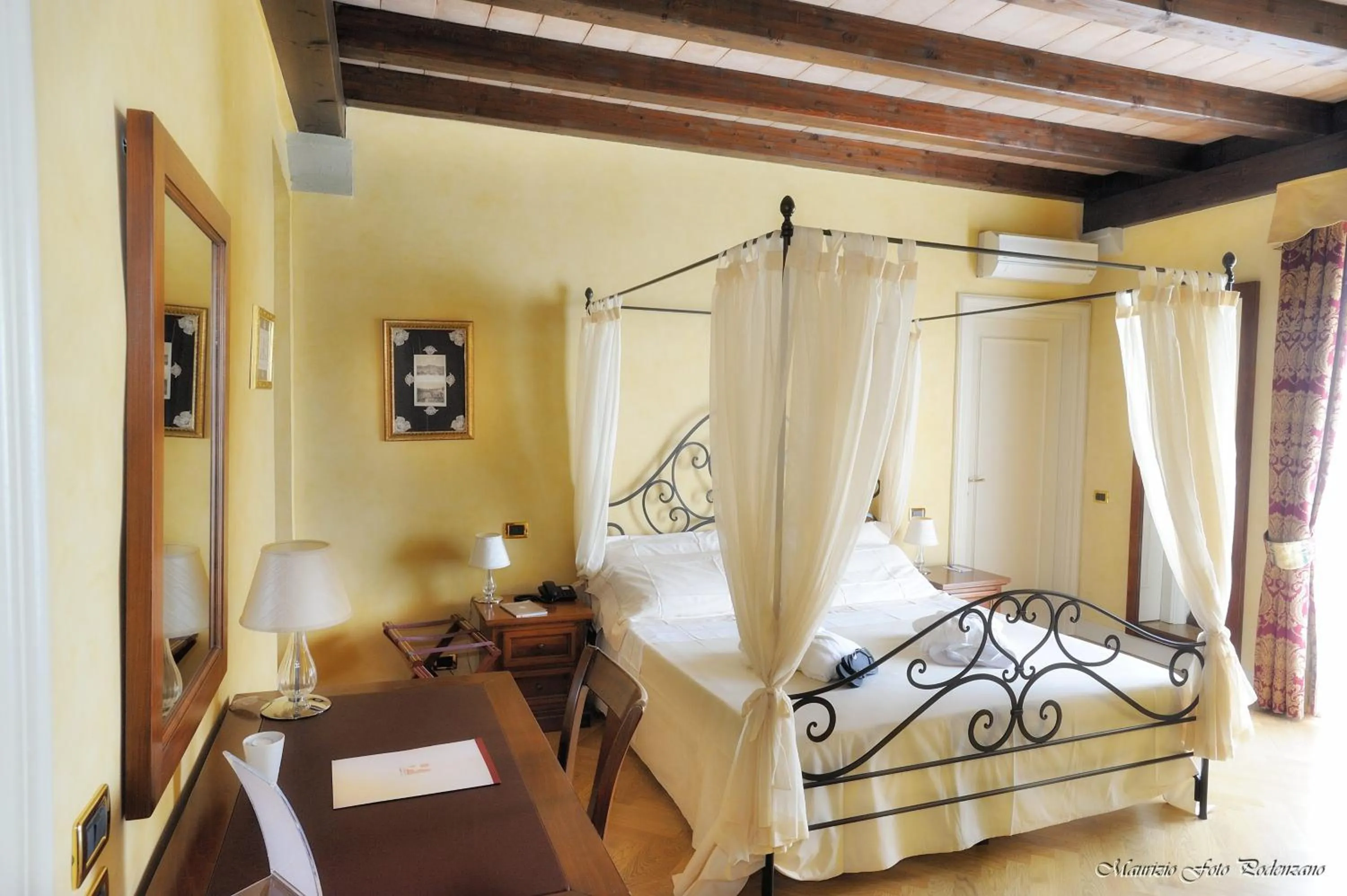 Bed in Relais La Colombara Spa & Wellness