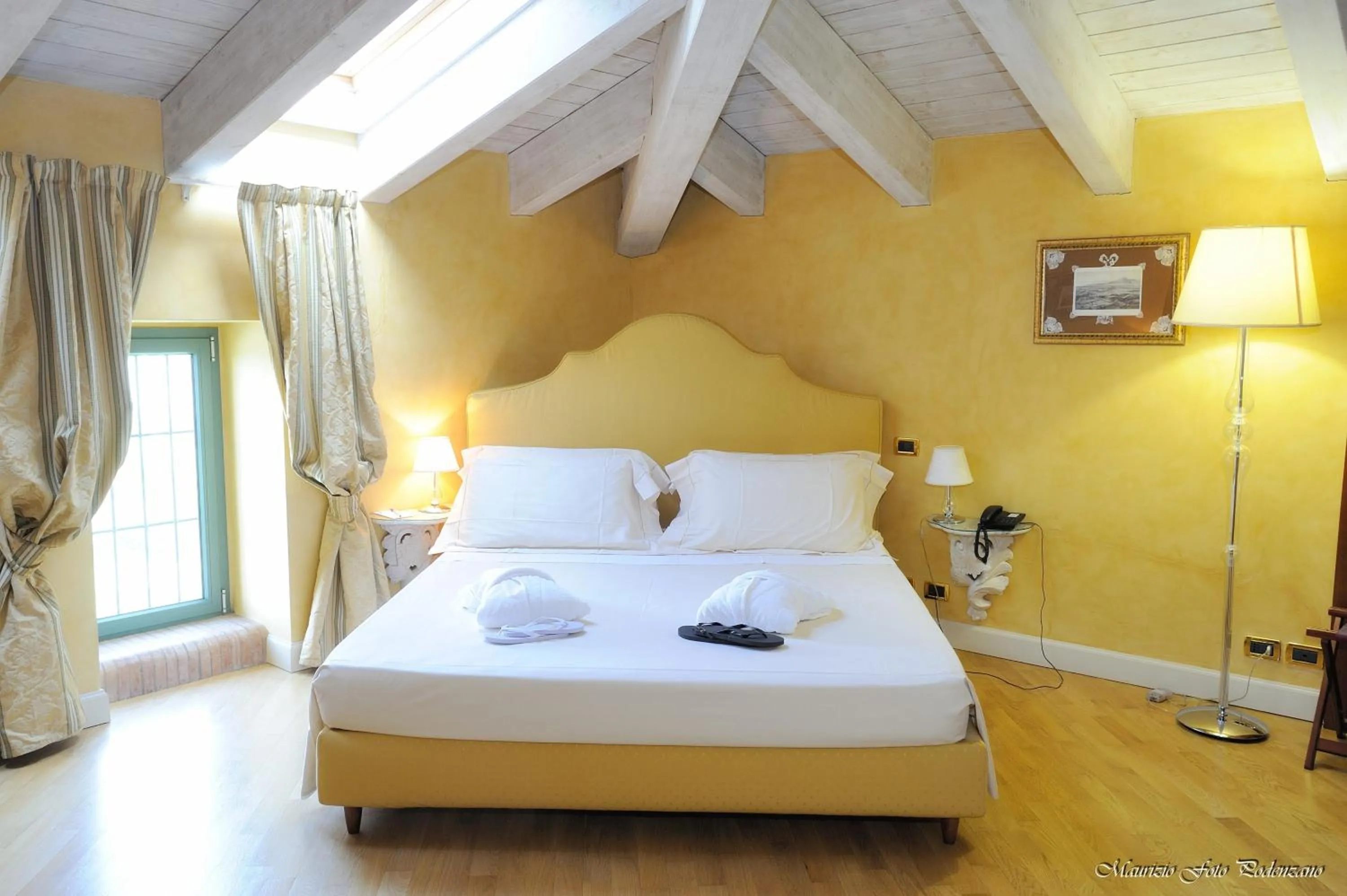 Bed in Relais La Colombara Spa & Wellness