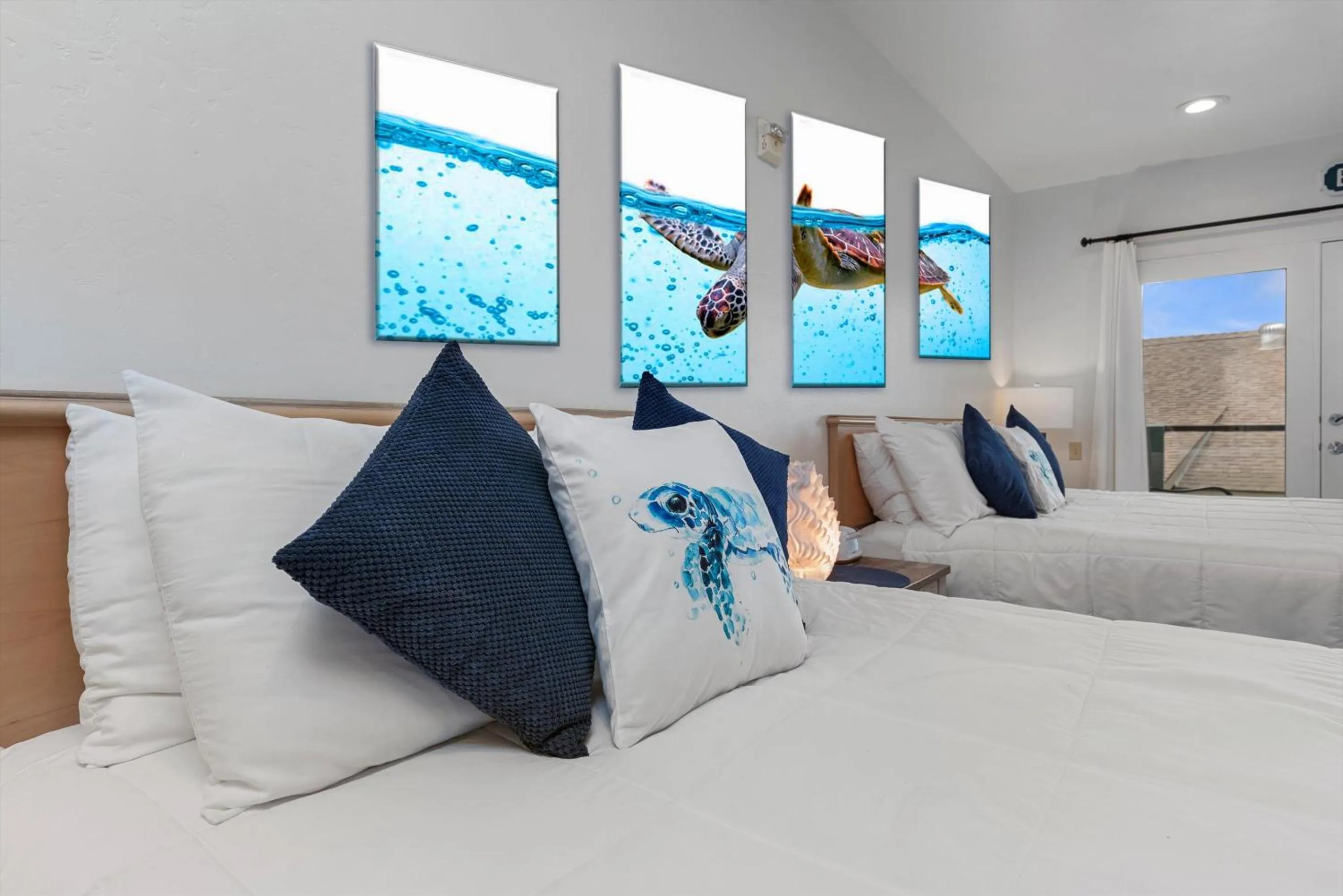 Bed in Beach House Inn & Suites