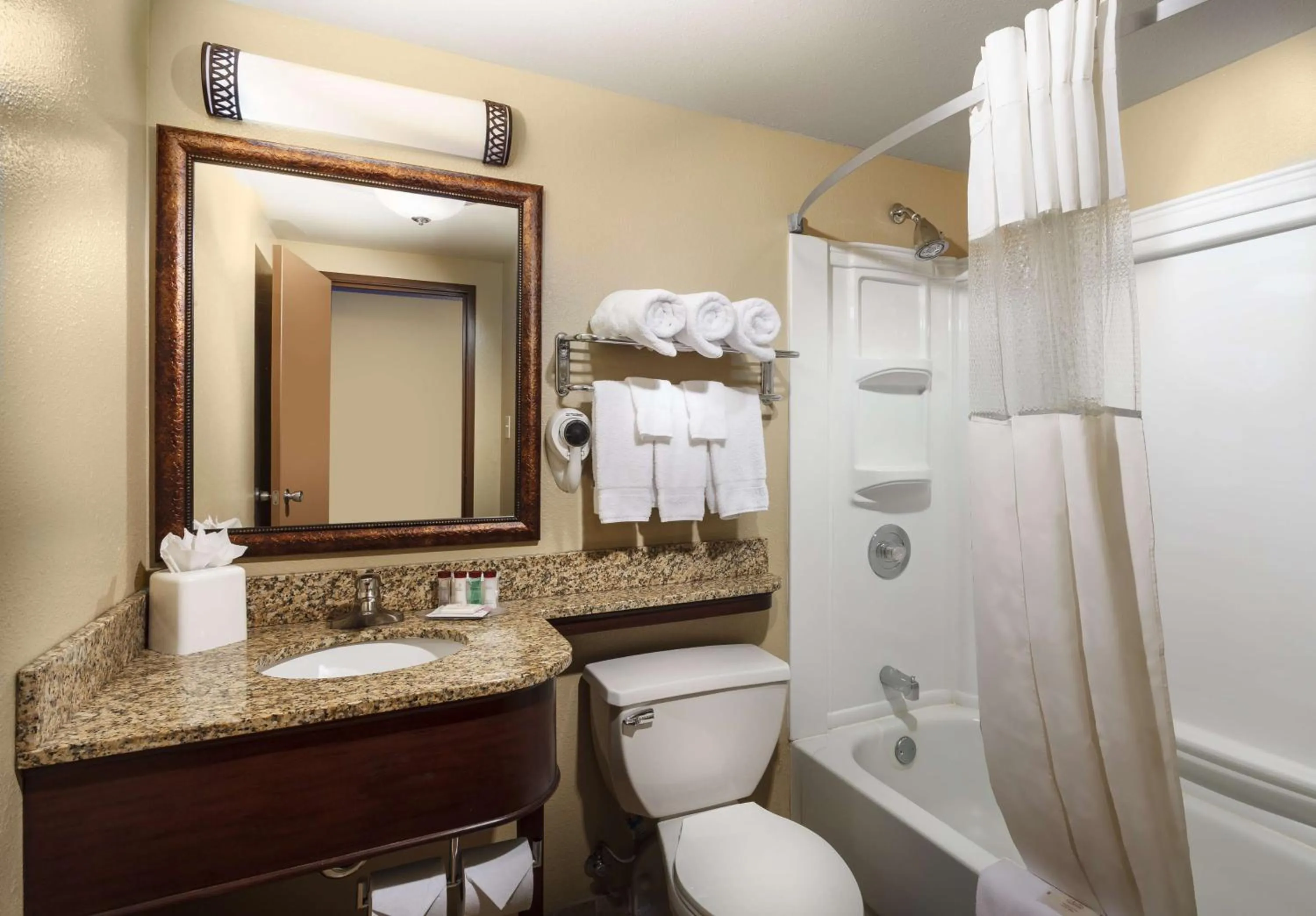 Bathroom in Roosevelt Grand Dakota SureStay Collection by Best Western