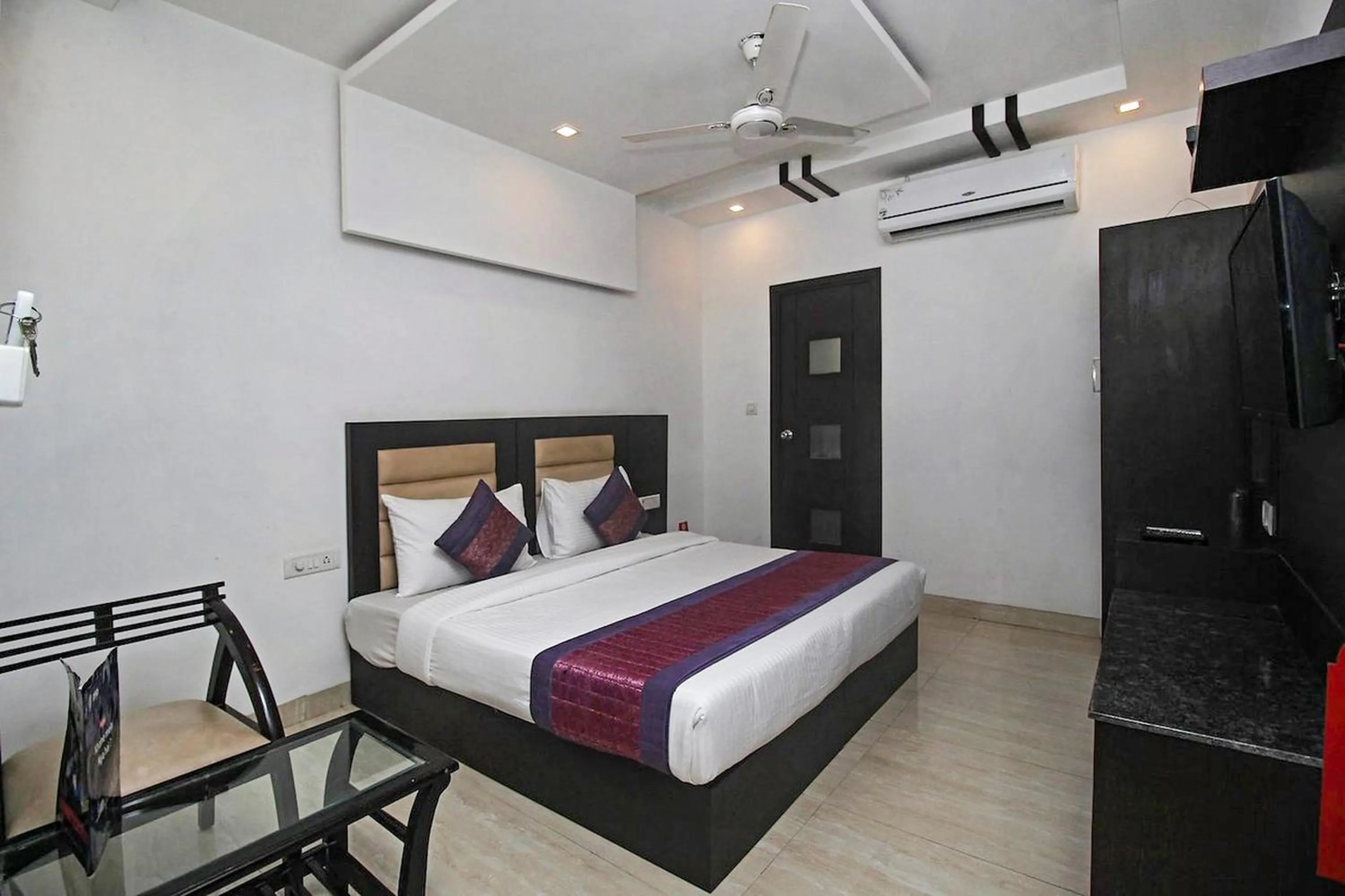 Bedroom in FabHotel Arihant Inn
