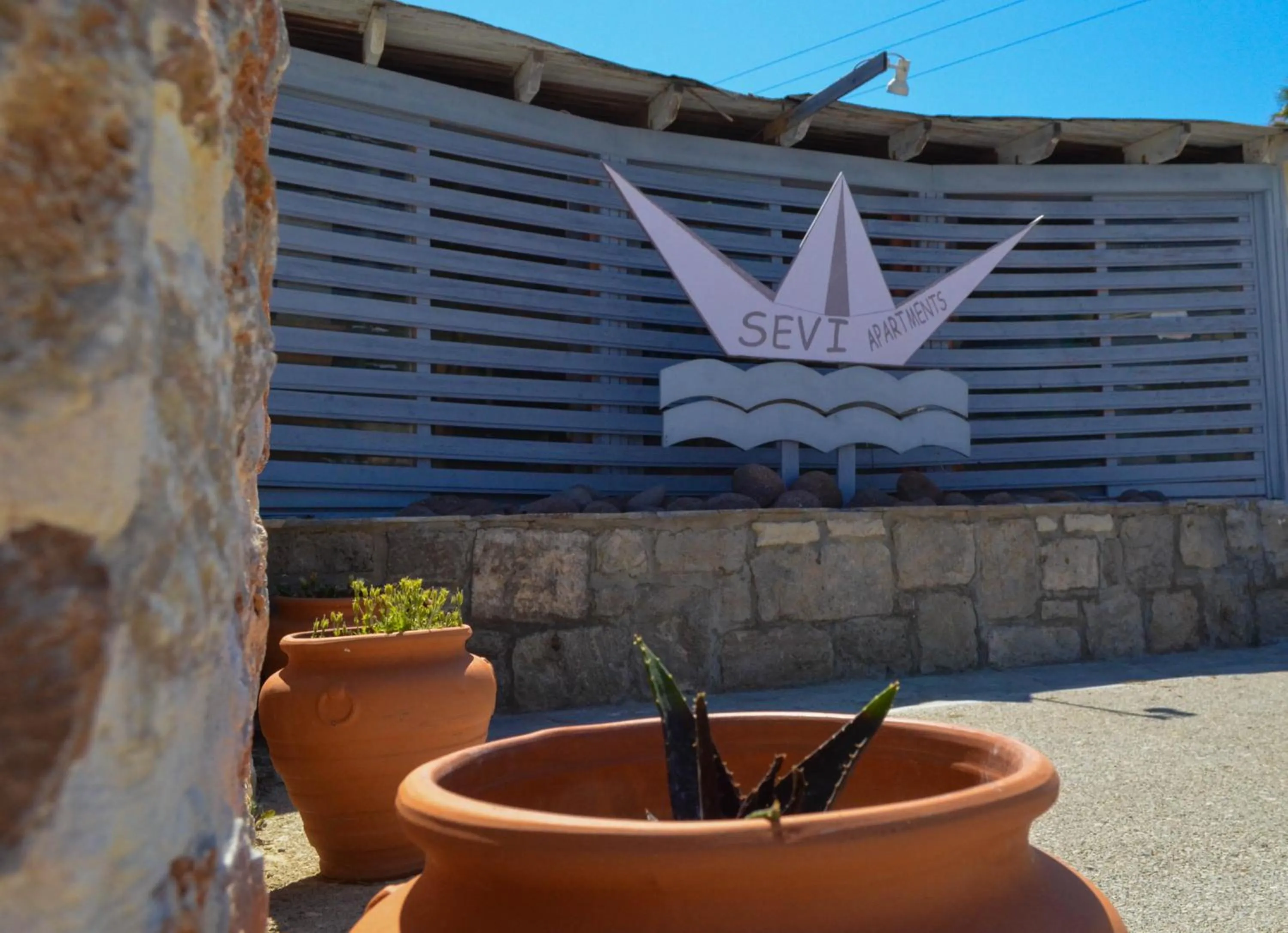 Property logo or sign in Sevi Apartments