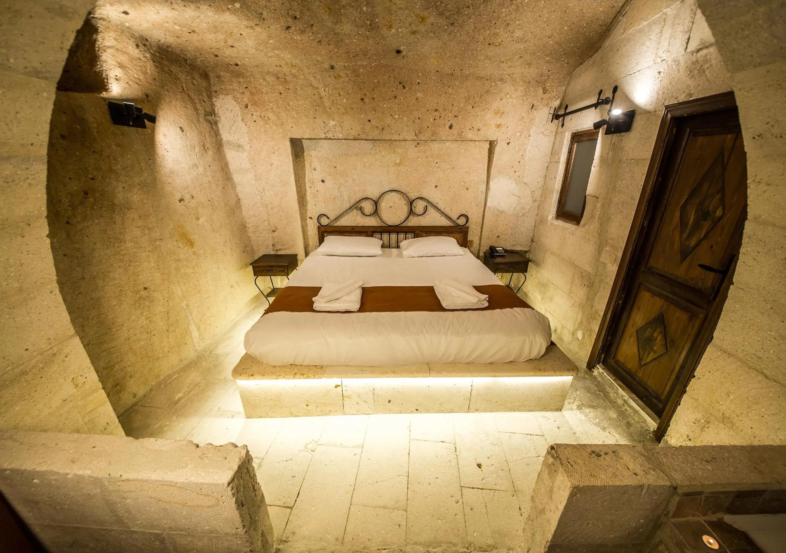 Bed in Harkasos Cave Hotel