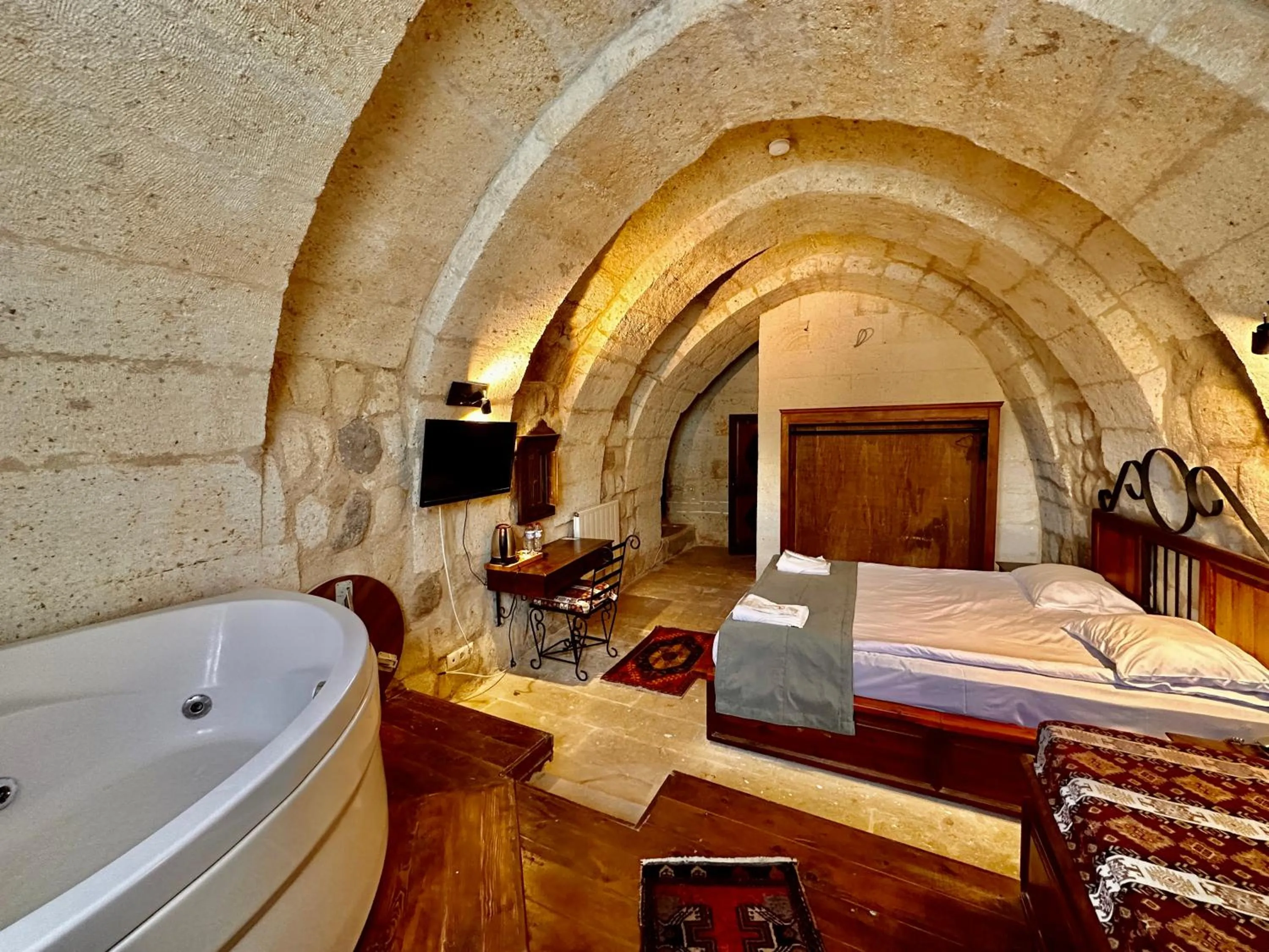 Bed in Harkasos Cave Hotel