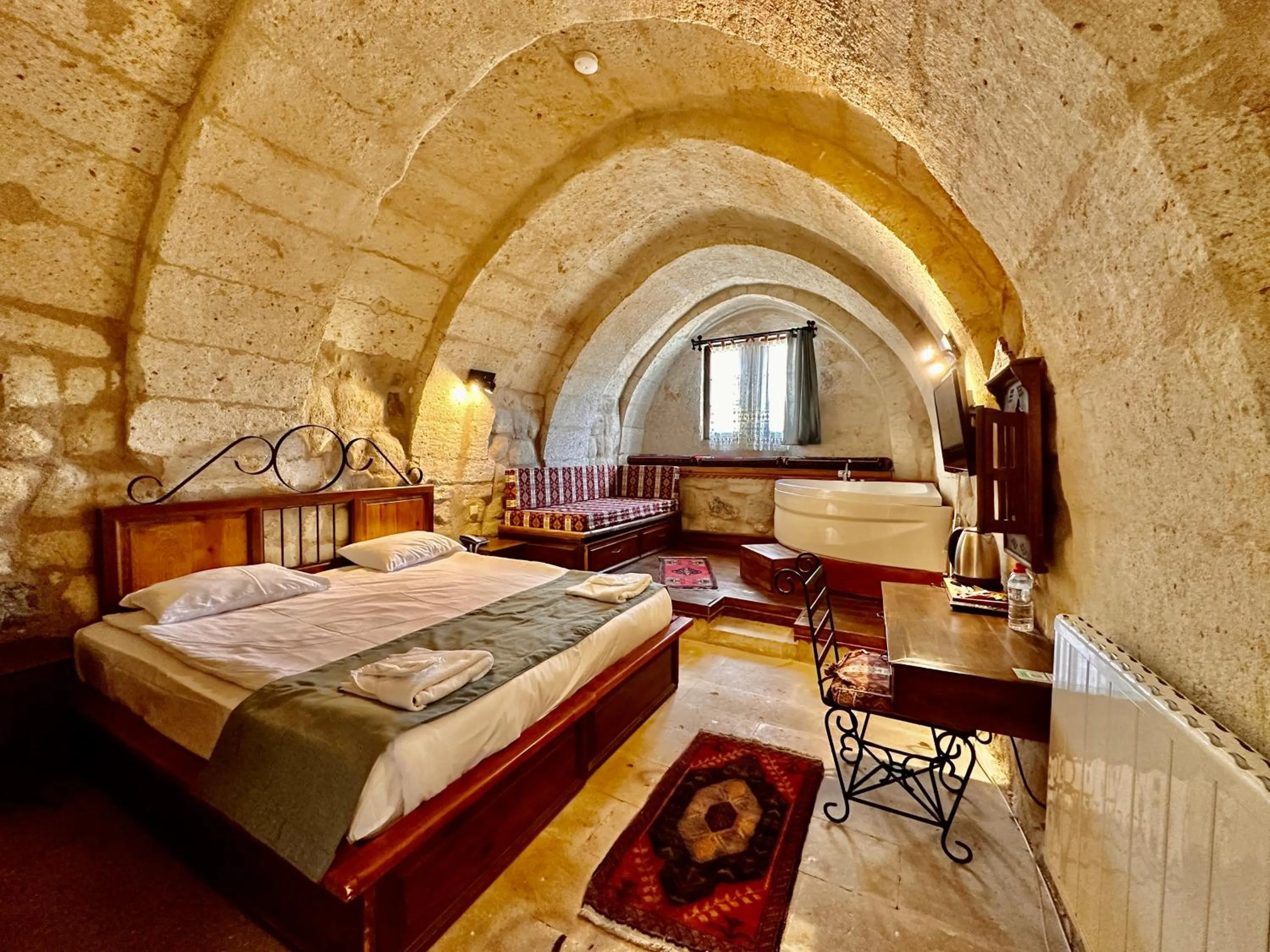 Bed in Harkasos Cave Hotel
