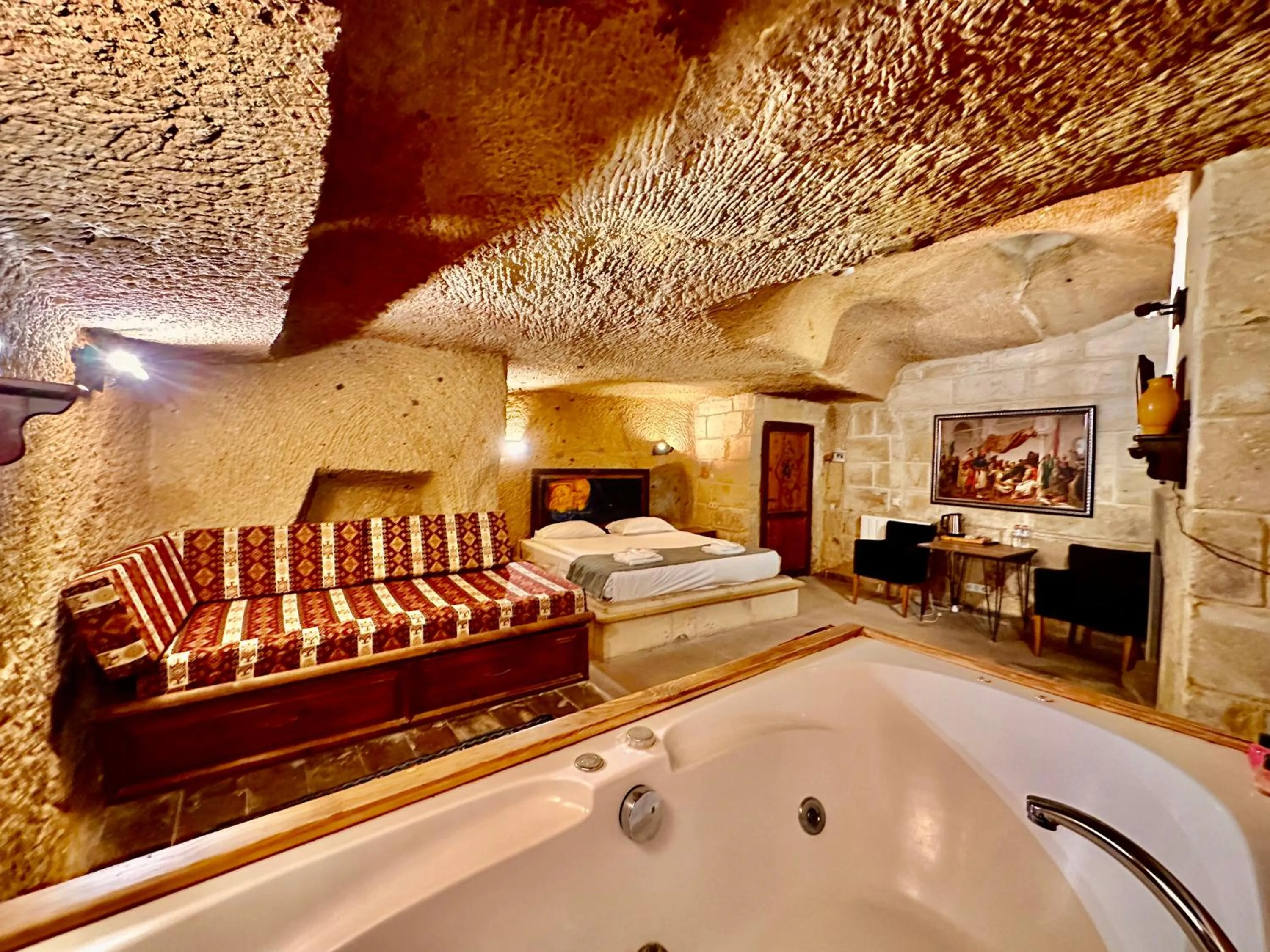 Bed in Harkasos Cave Hotel
