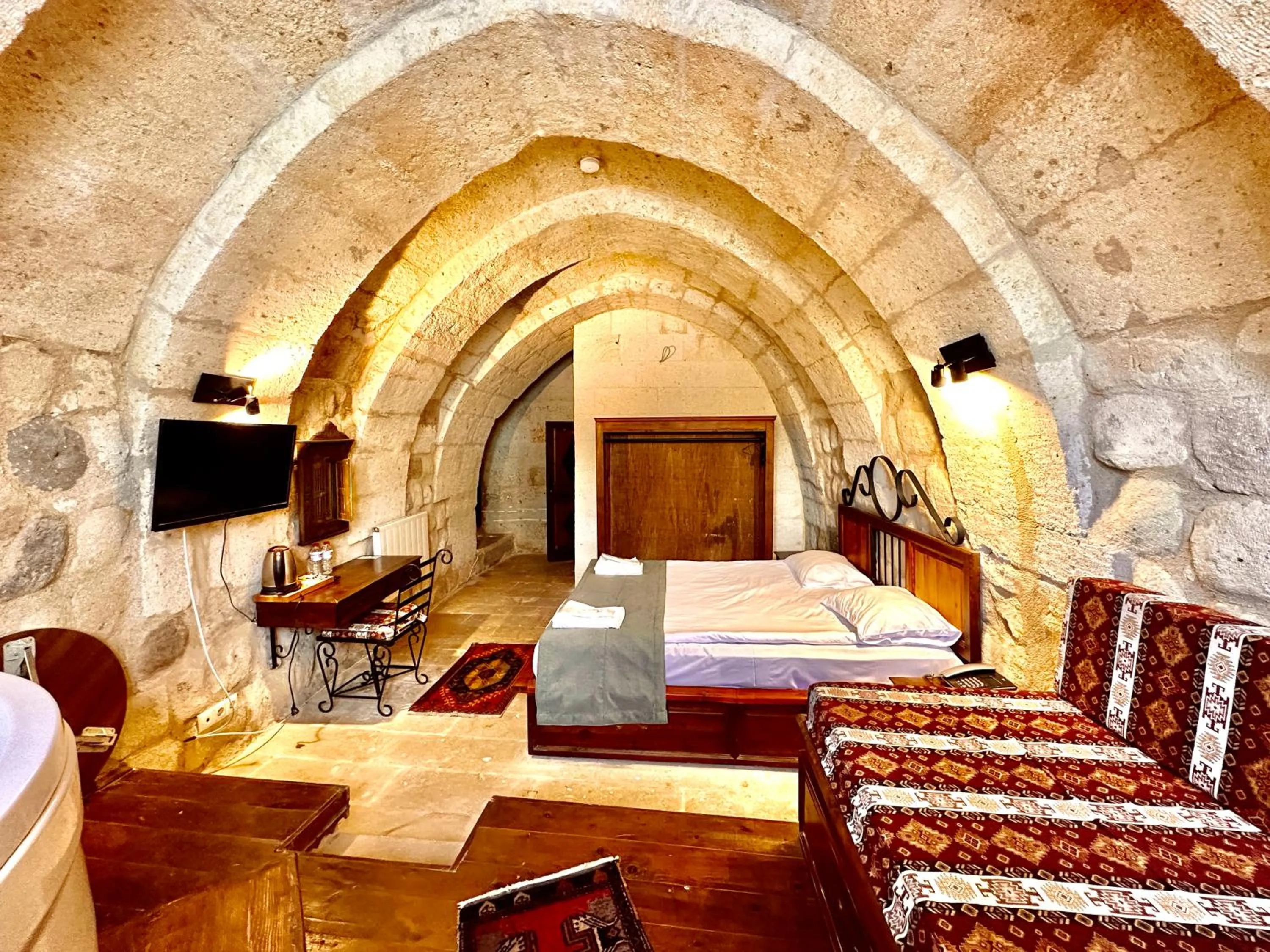 Bed in Harkasos Cave Hotel