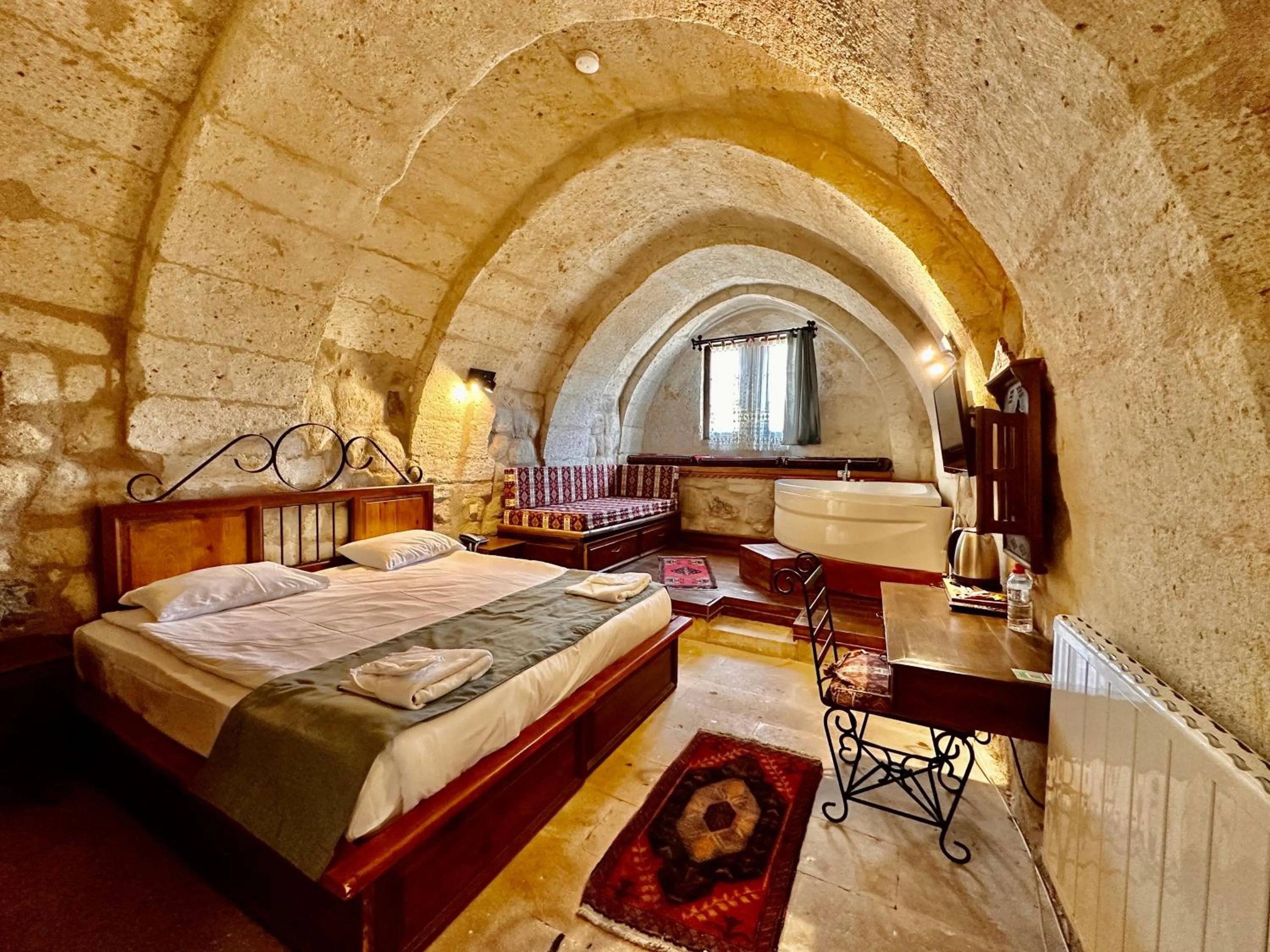 Bed in Harkasos Cave Hotel