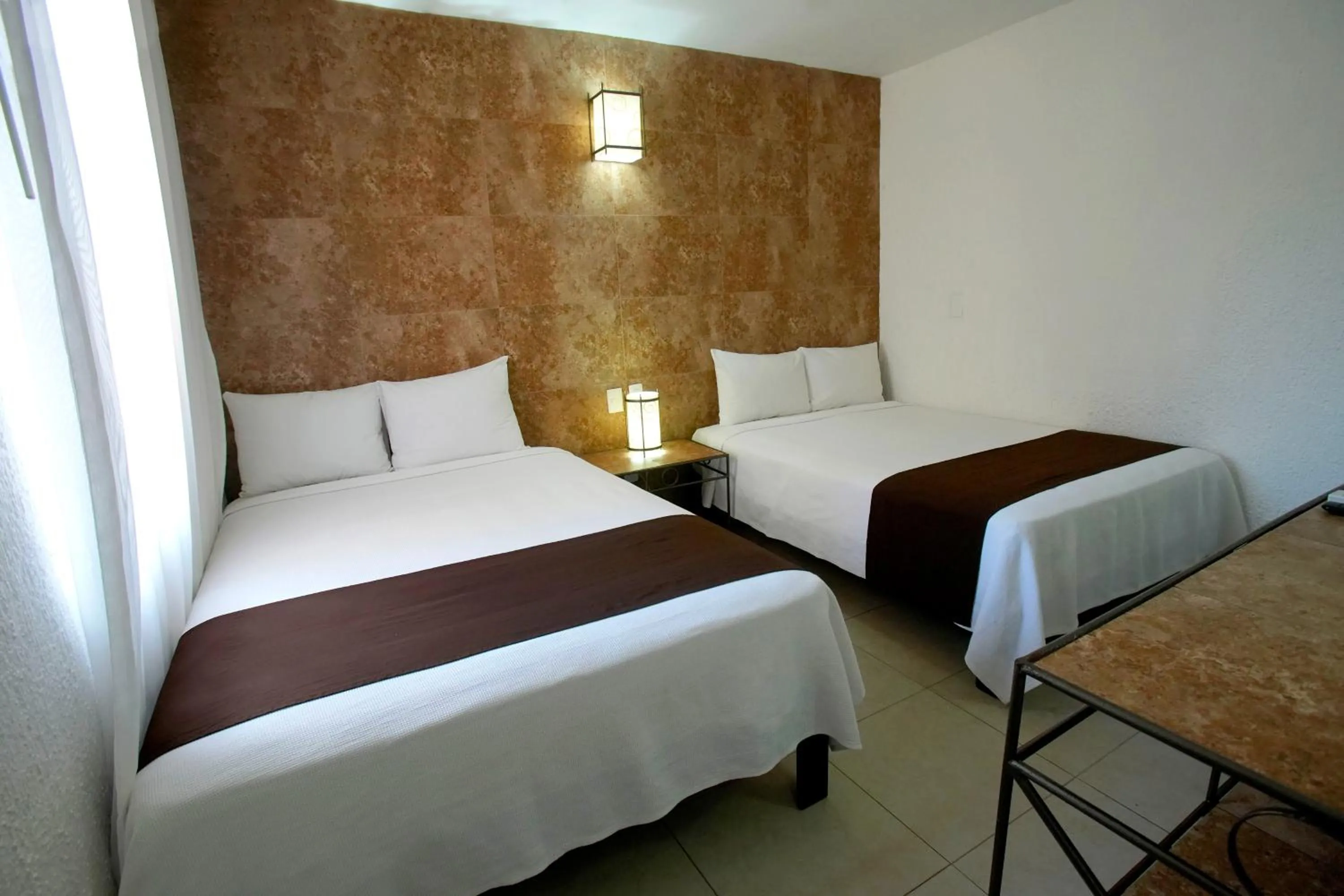 Bed in Tukan Hotel Playa del Carmen