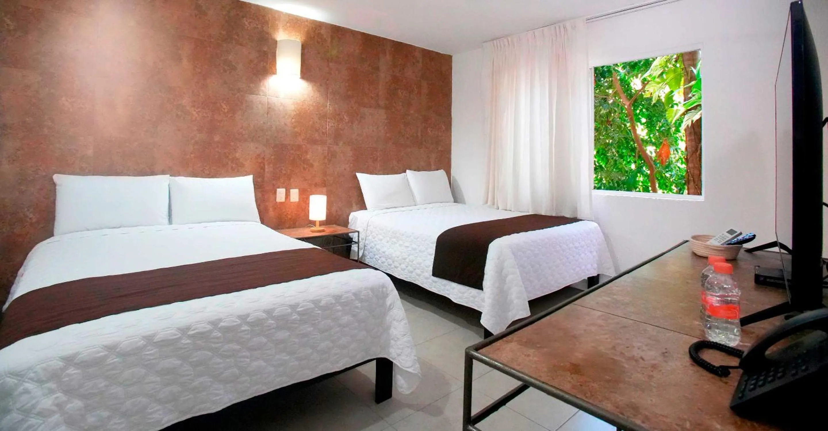 Bed in Tukan Hotel Playa del Carmen