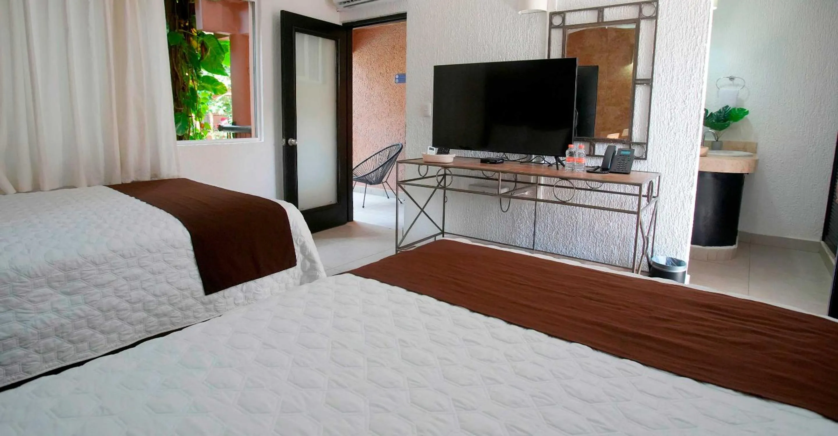 Bed in Tukan Hotel Playa del Carmen