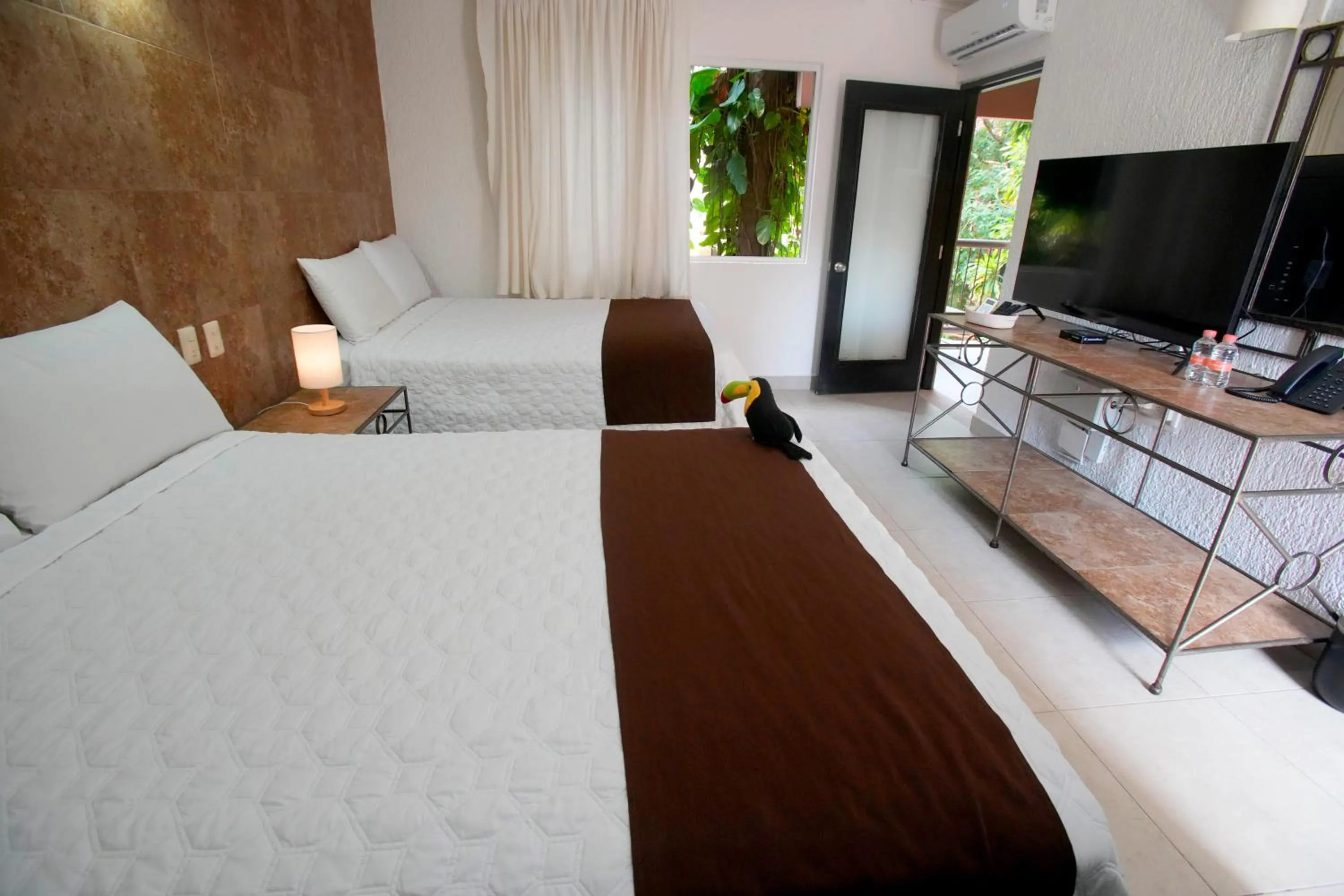 Bed in Tukan Hotel Playa del Carmen