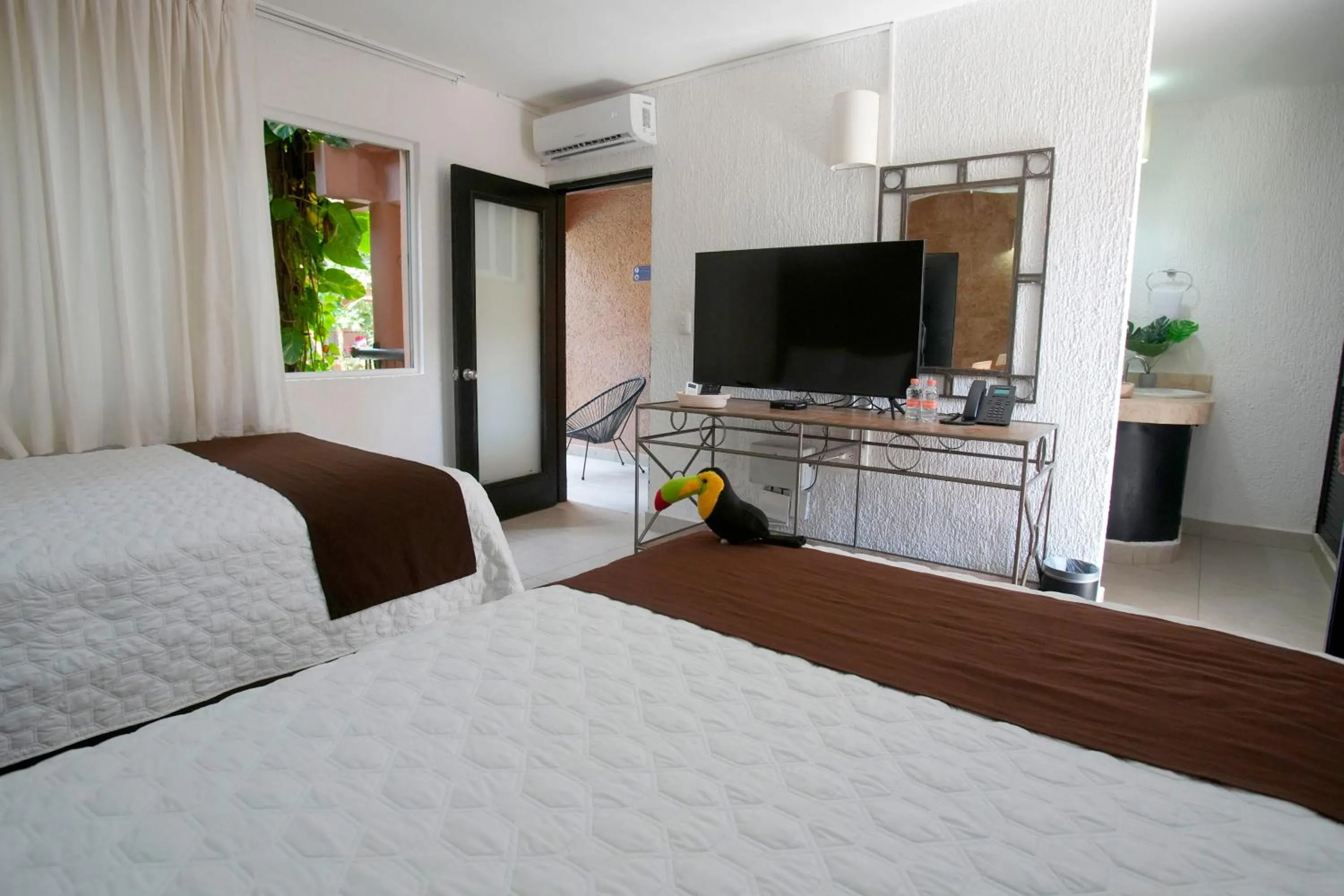 Photo of the whole room, Bed in Tukan Hotel Playa del Carmen