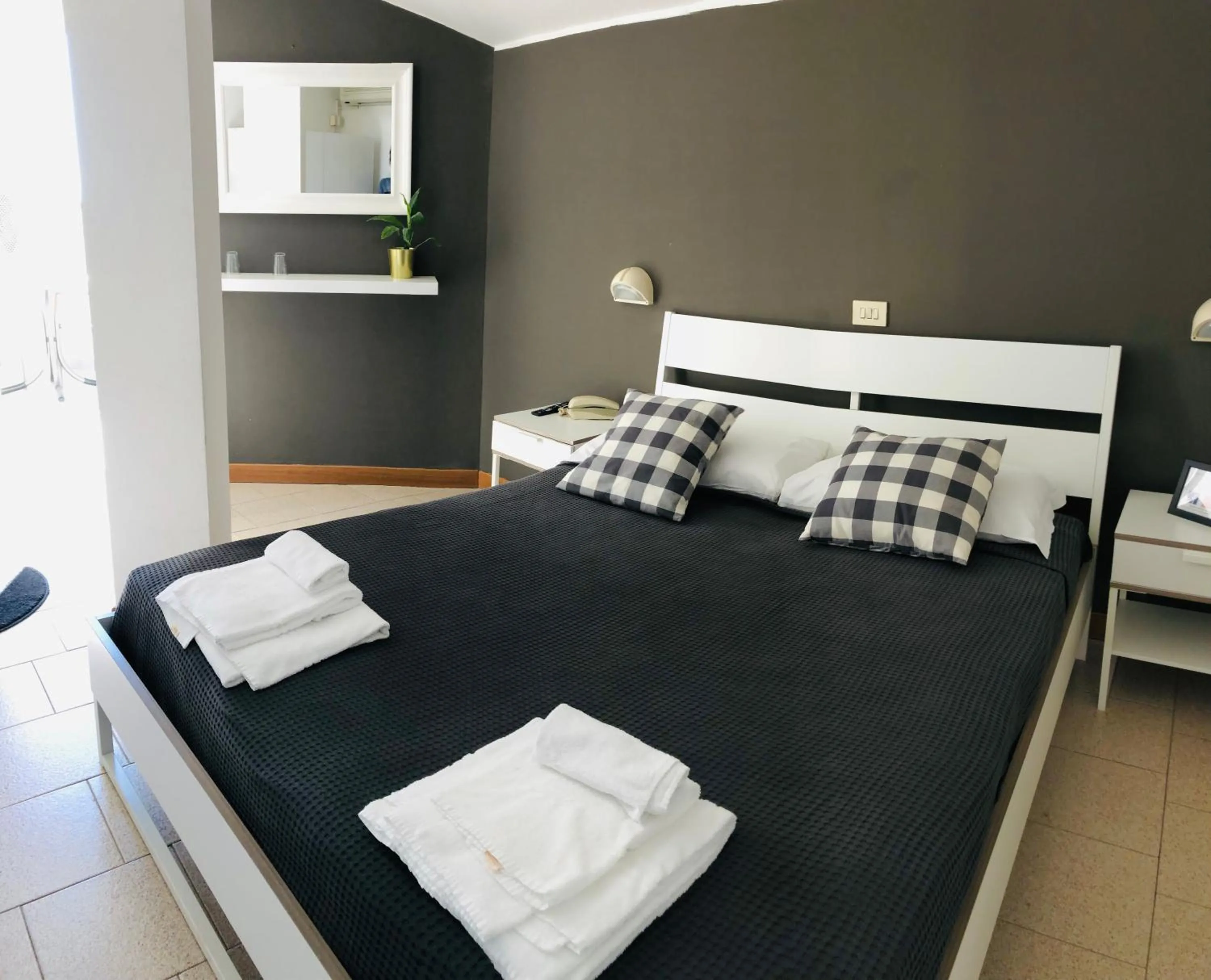 Bed in Hotel Aplo - Breakfast Experience