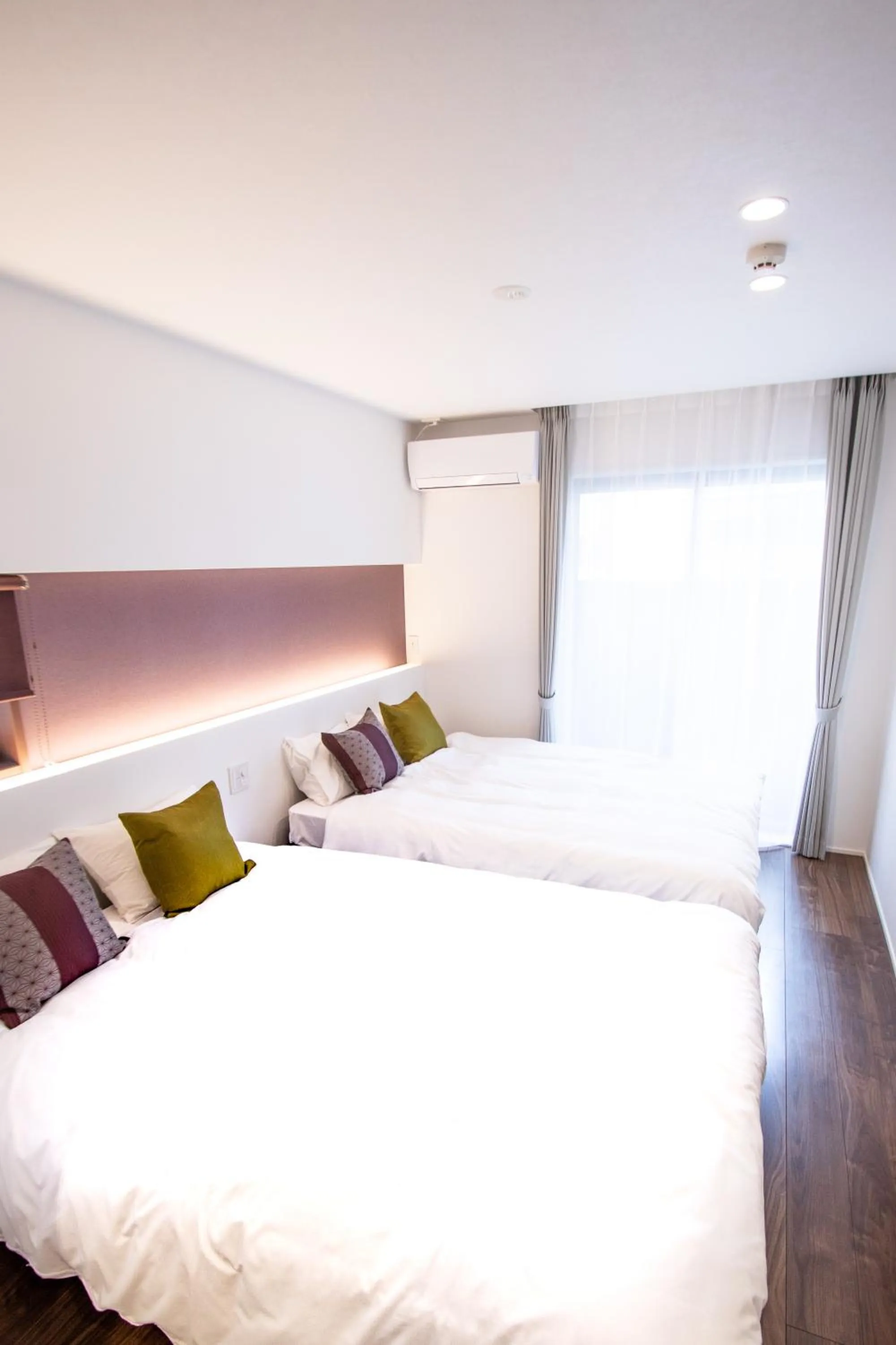 Bed in Apartment Hotel Tenjin TUMUGU