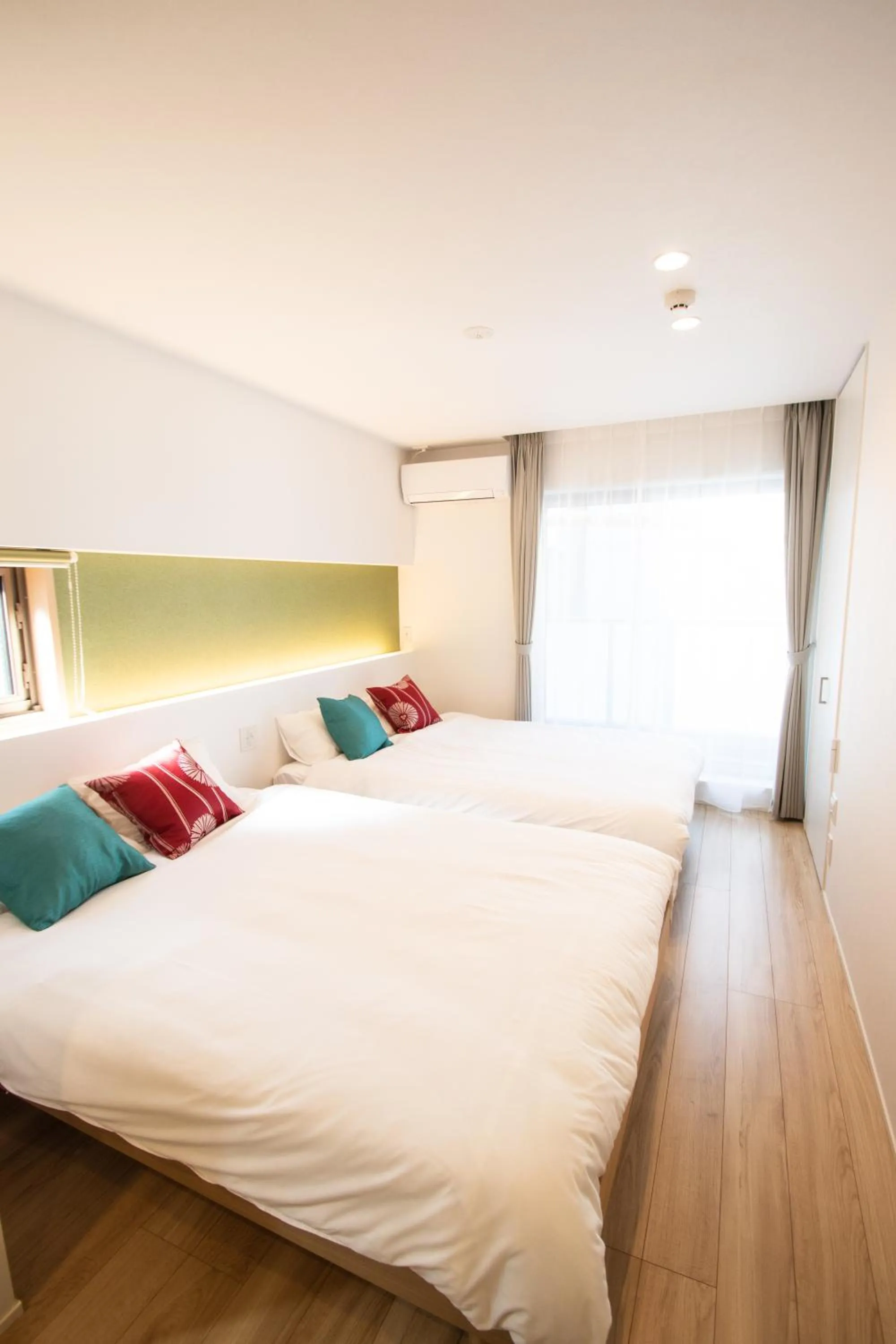 Bed in Apartment Hotel Tenjin TUMUGU