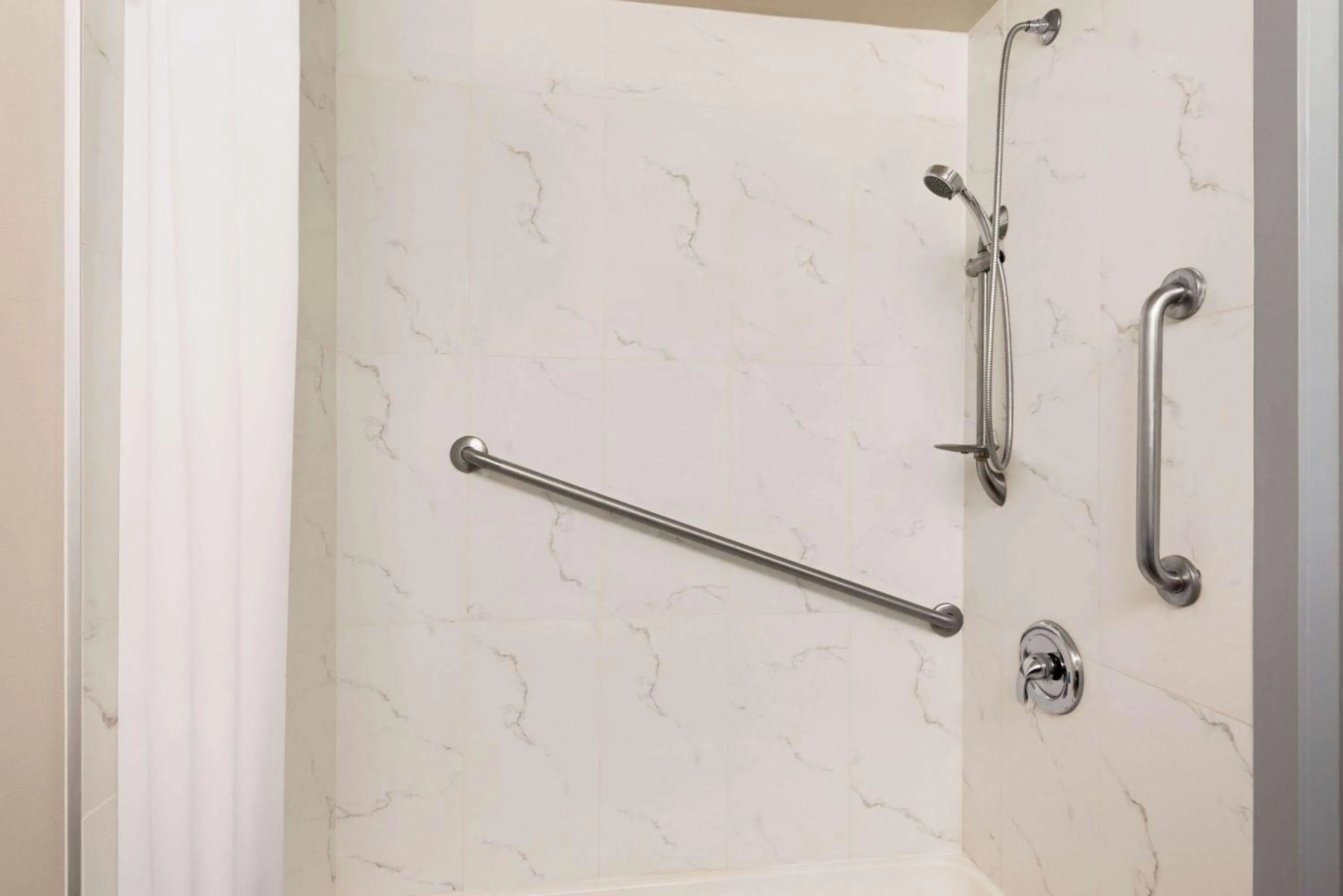 Bathroom in Travelodge by Wyndham Calgary South