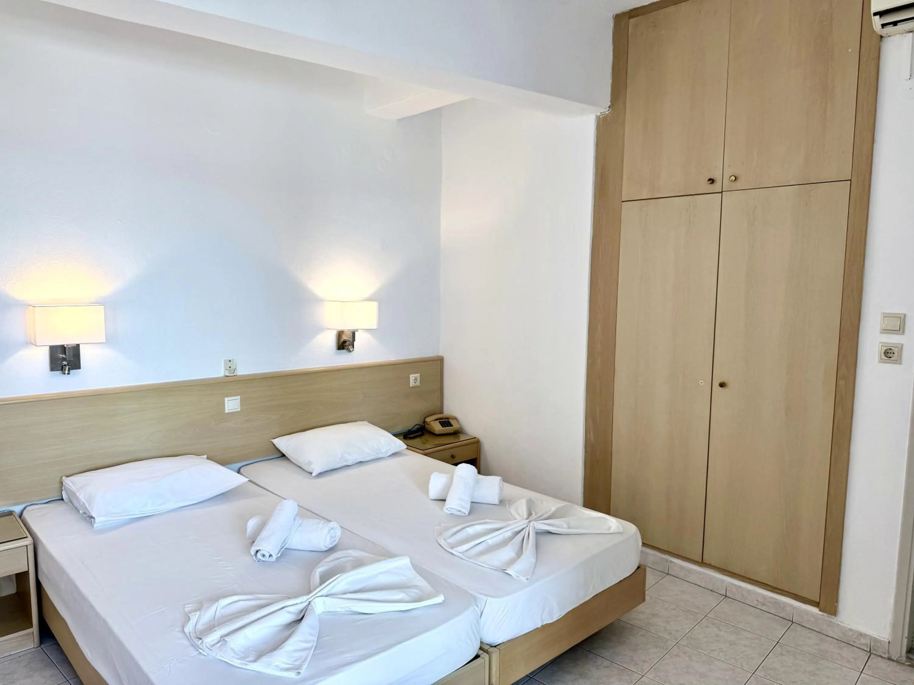 Bed in Savoy City Hotel