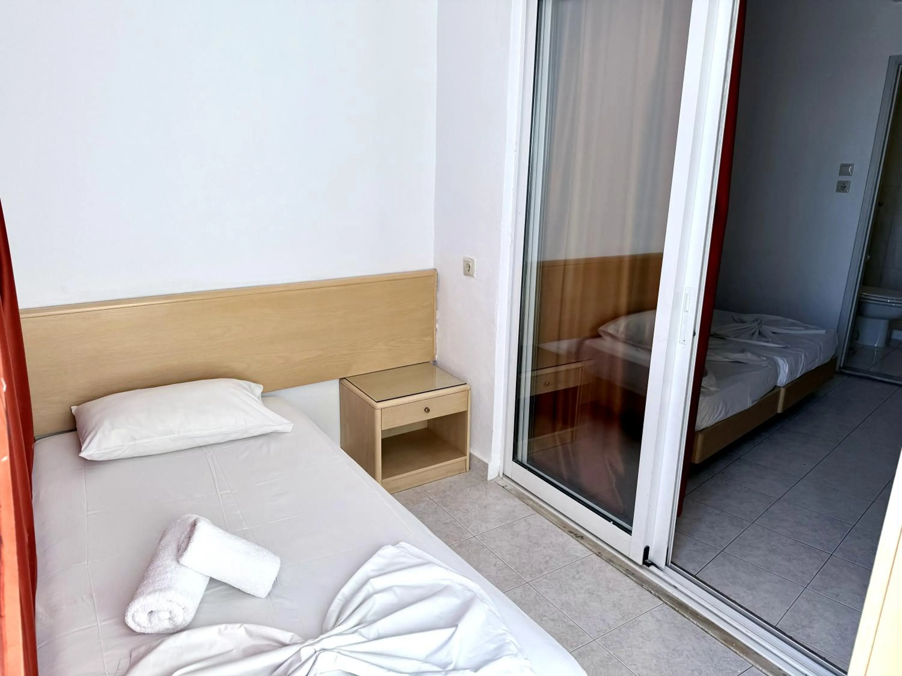 Bed in Savoy City Hotel