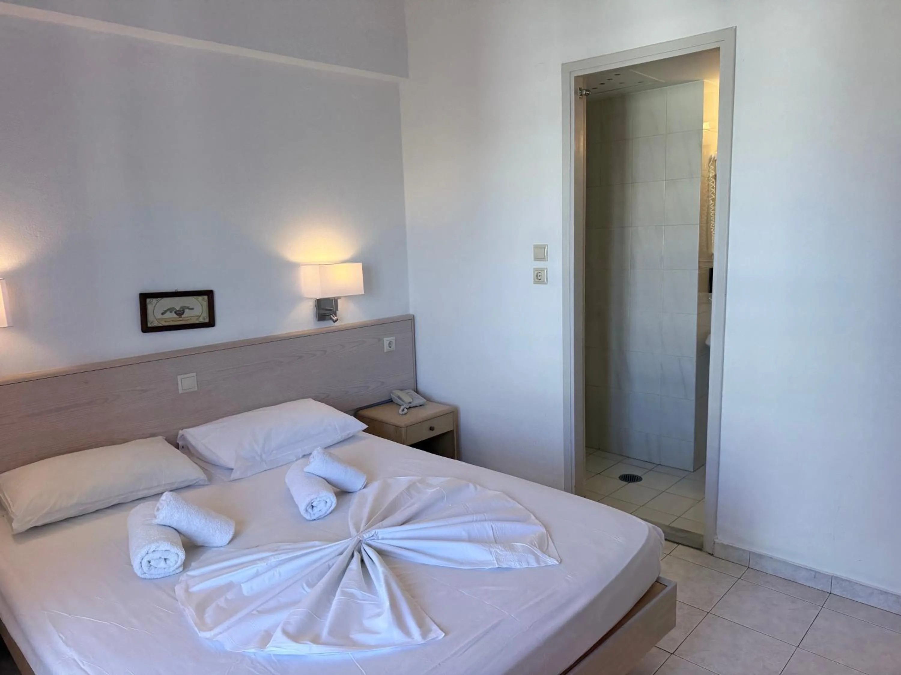 Bed in Savoy City Hotel