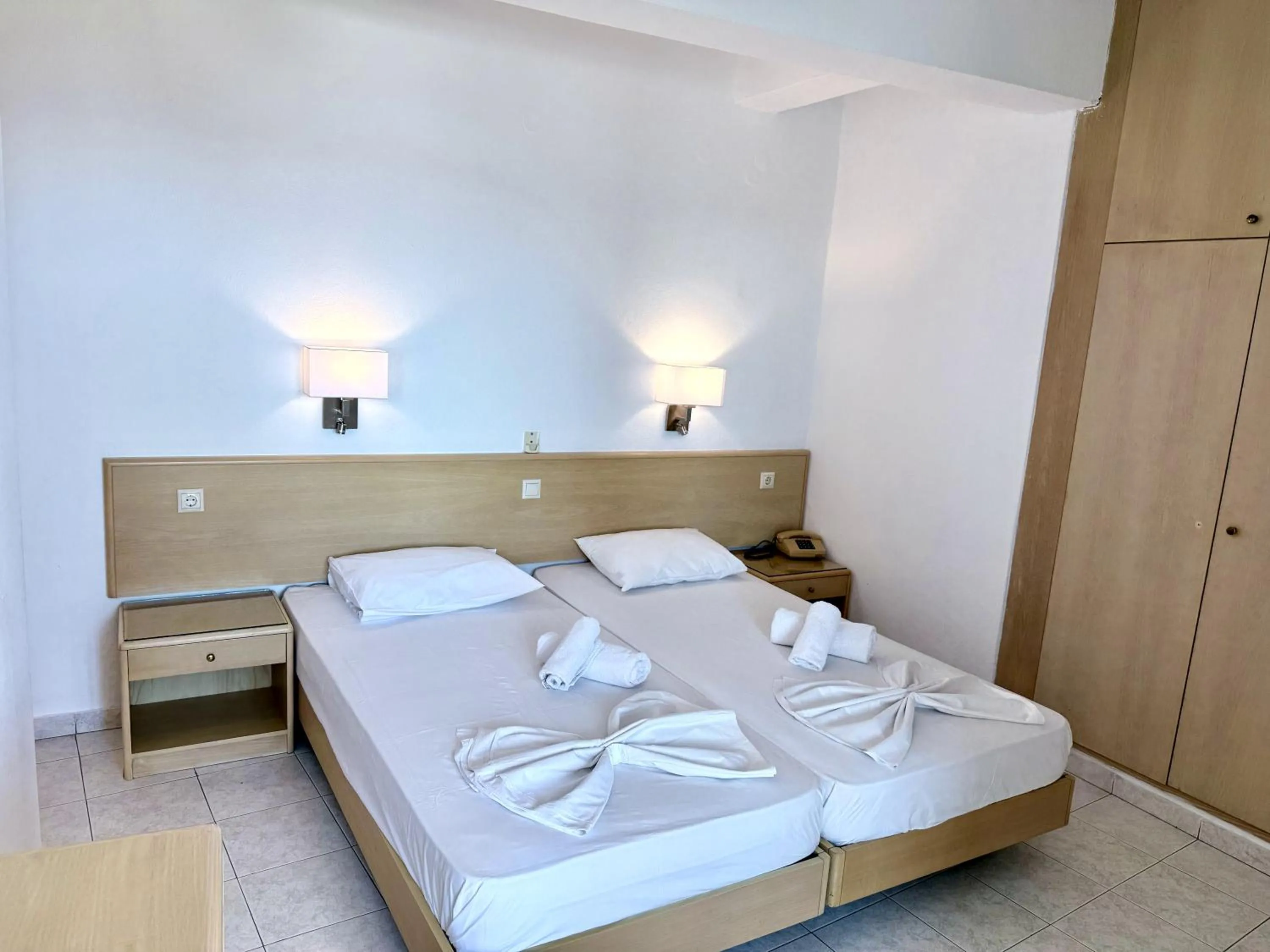 Bed in Savoy City Hotel