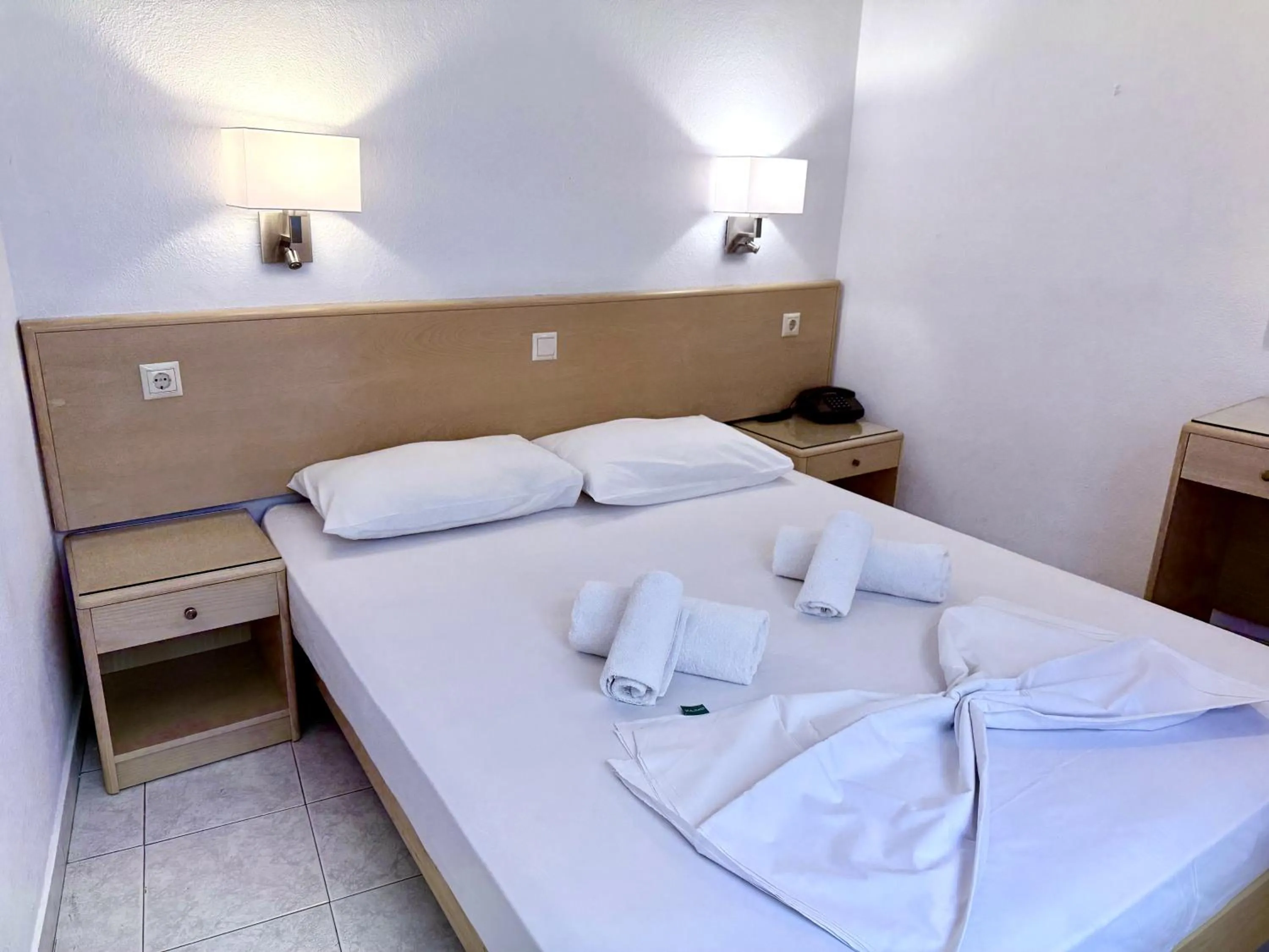 Bed in Savoy City Hotel