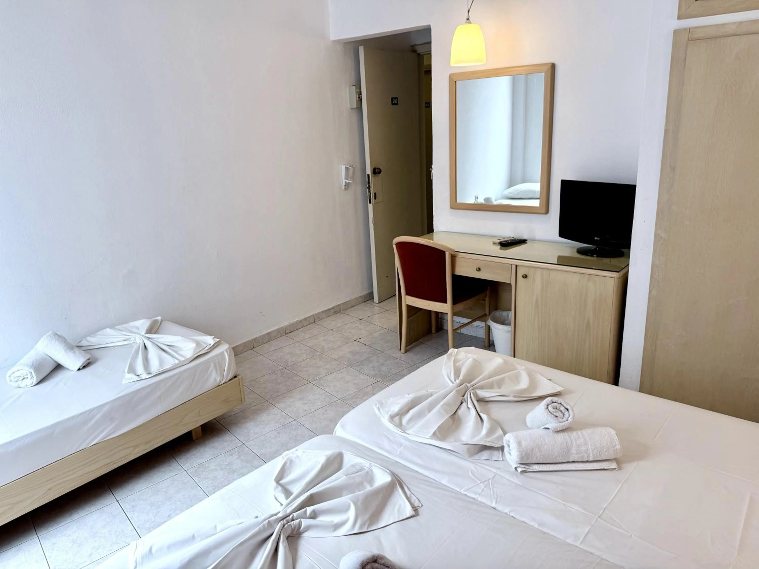 Bed in Savoy City Hotel