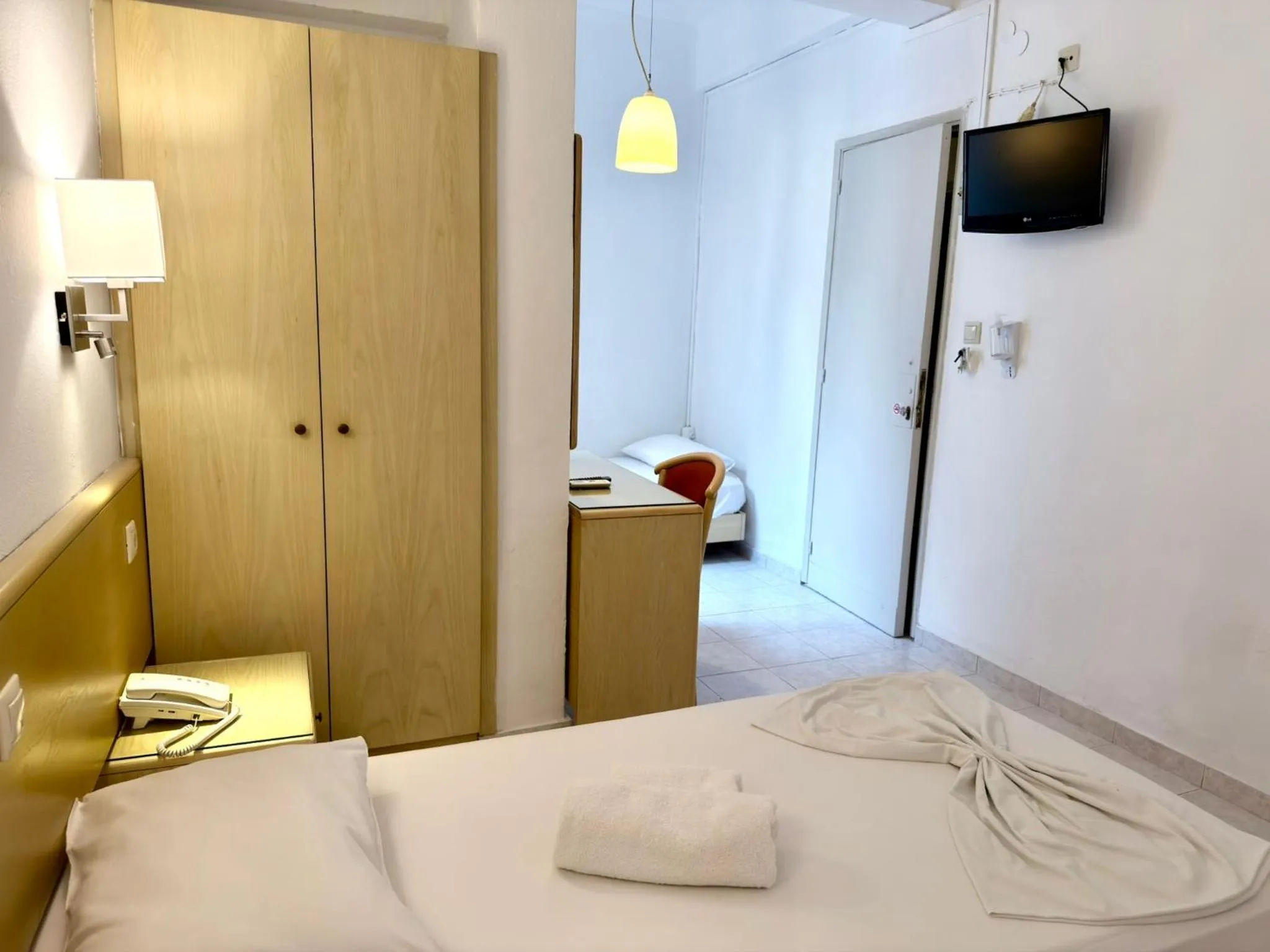 Bed in Savoy City Hotel